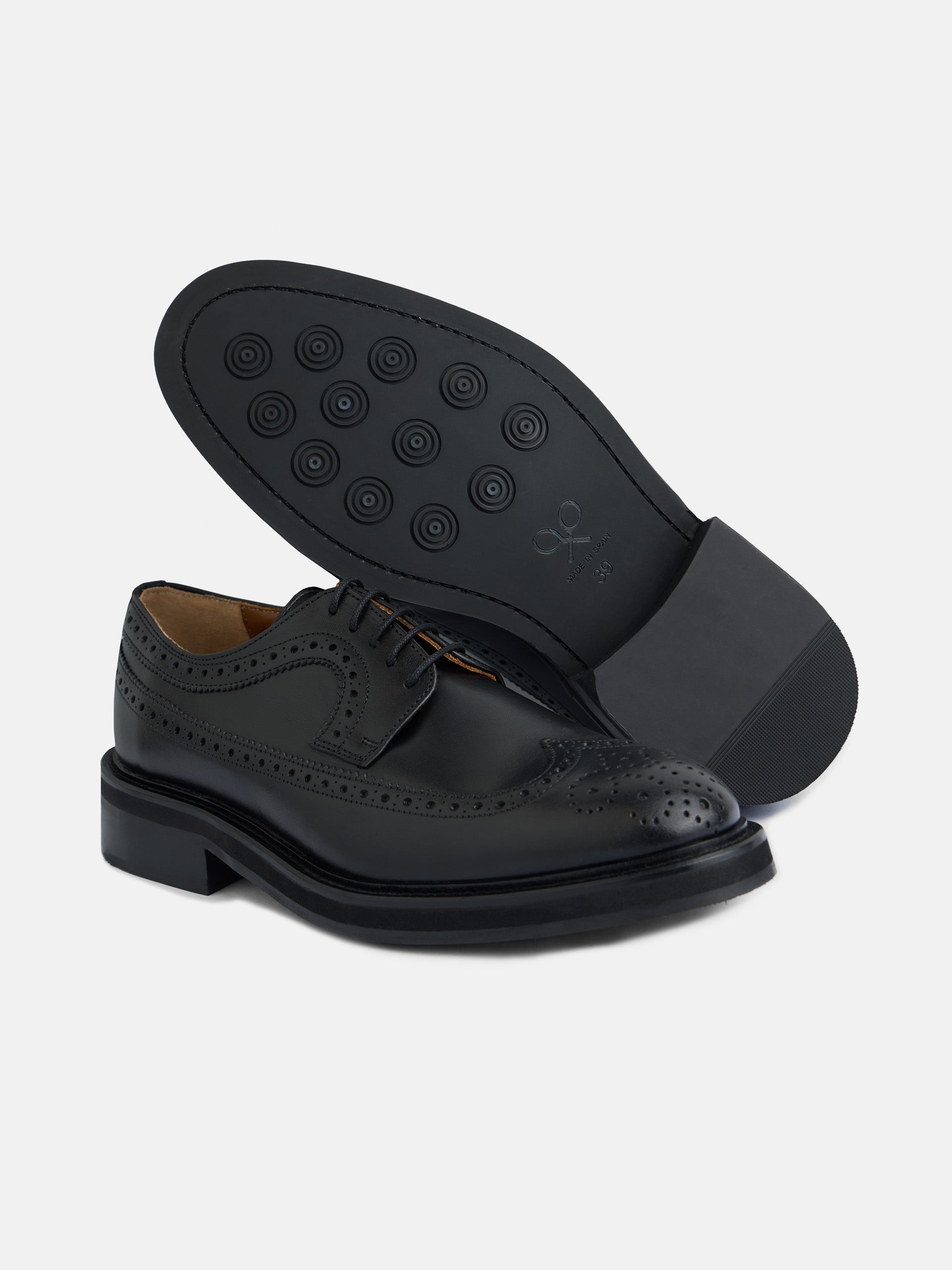 Classic perforated black leather shoe