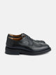 Classic perforated black leather shoe