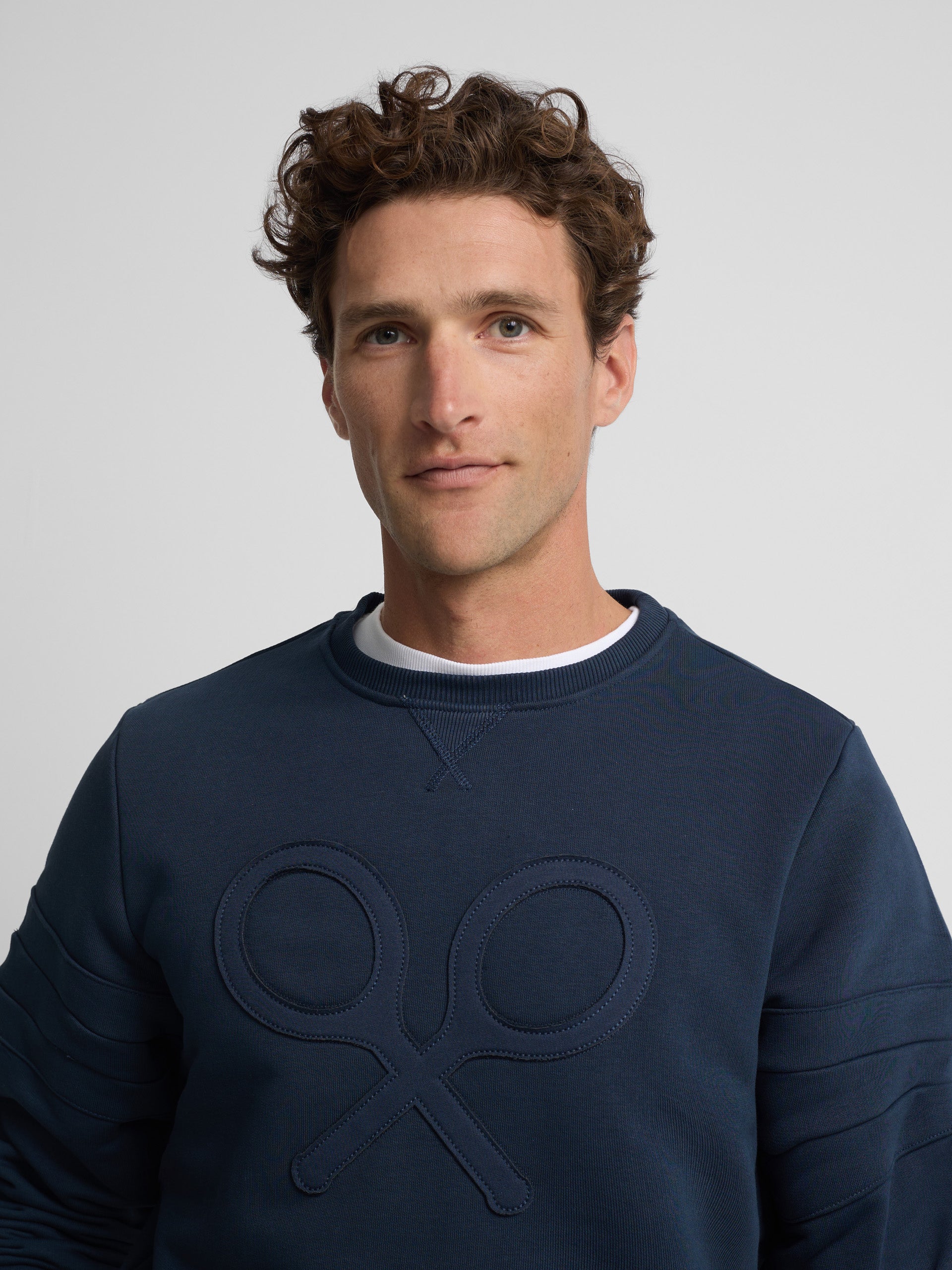 Navy tone embossed racket sweatshirt