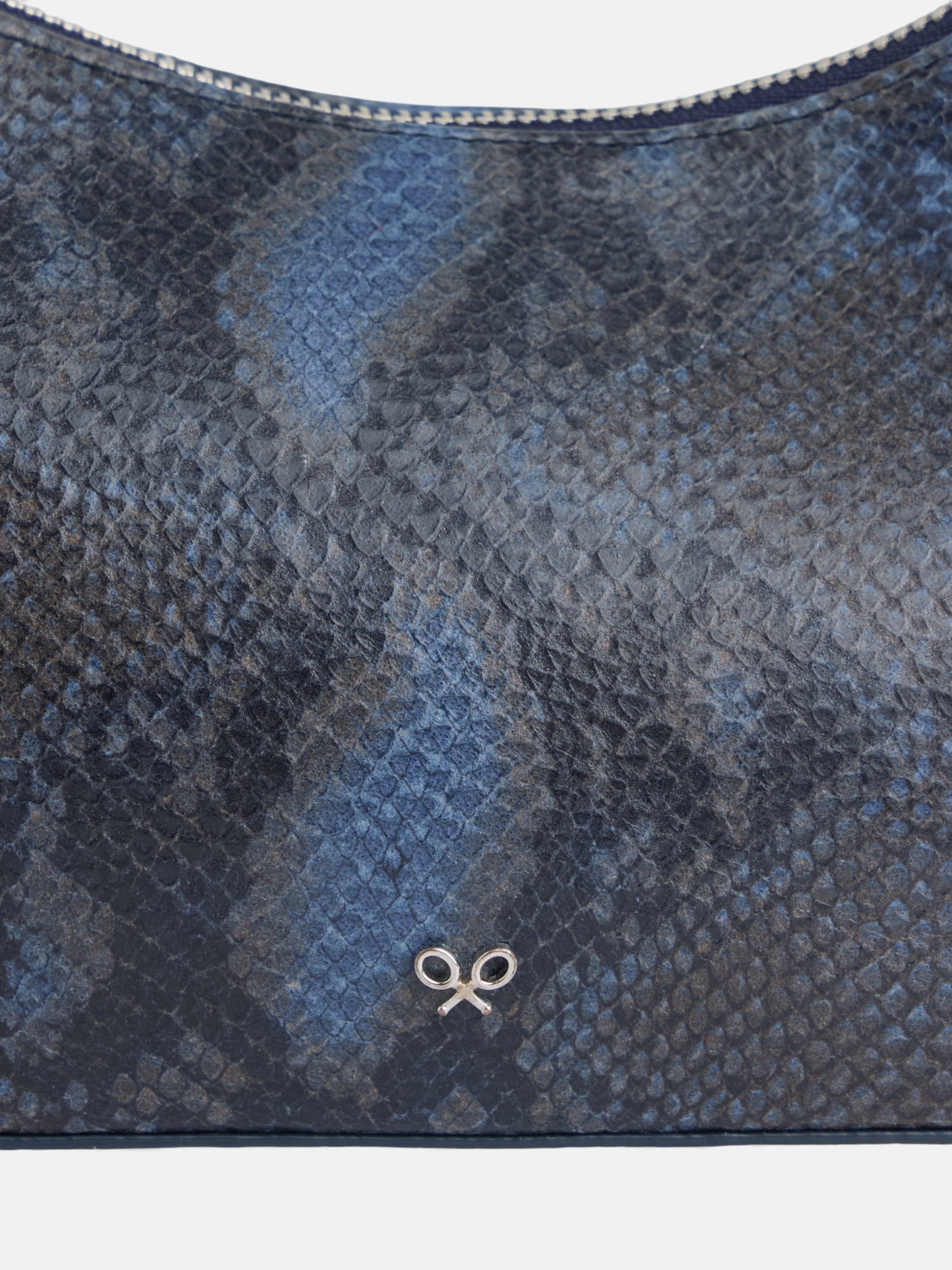 Bolso pochette piel animal print azul