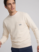 Sudadera bolsillo etiqueta crema