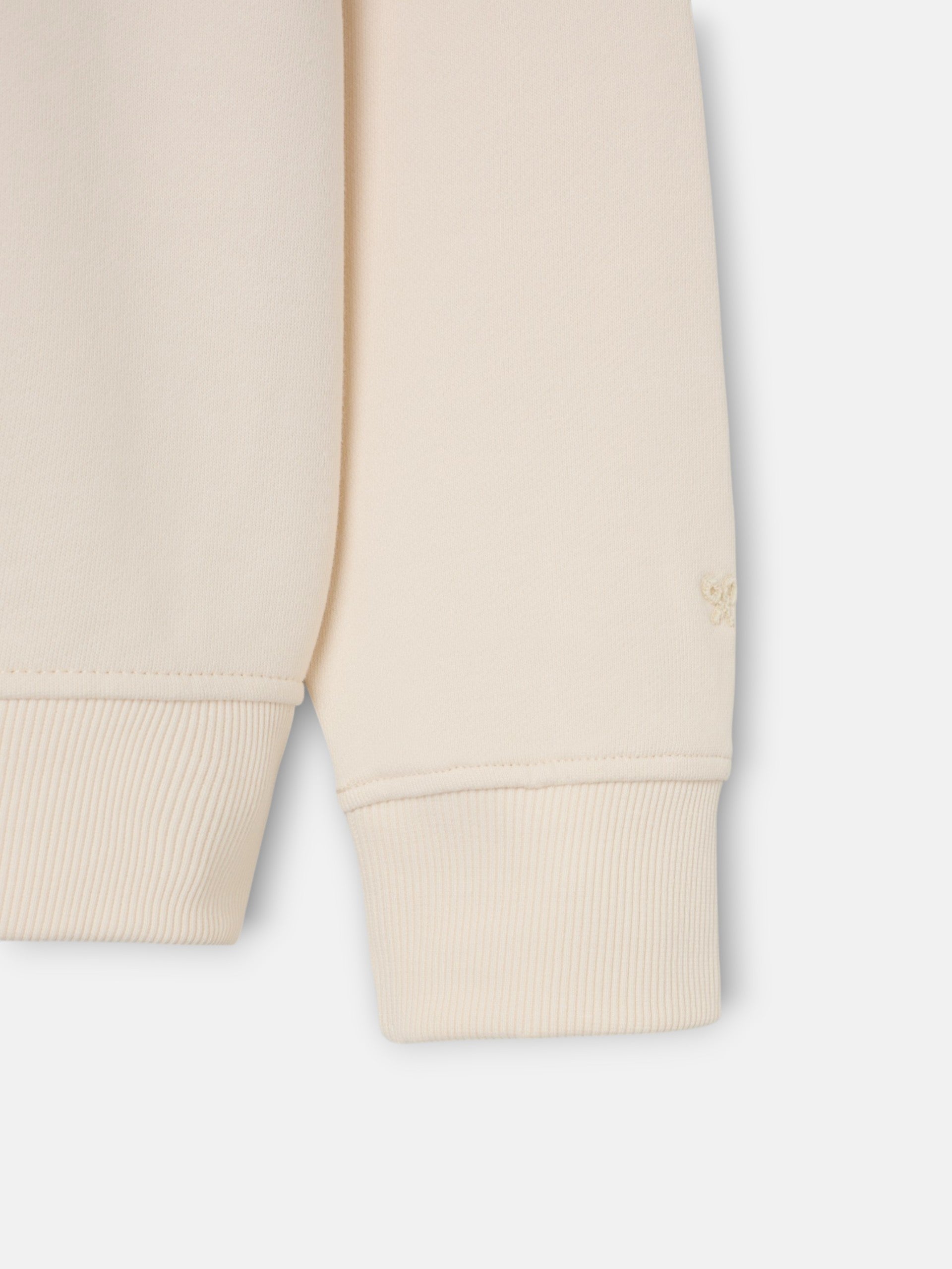 Sweatshirt bolso etiqueta creme