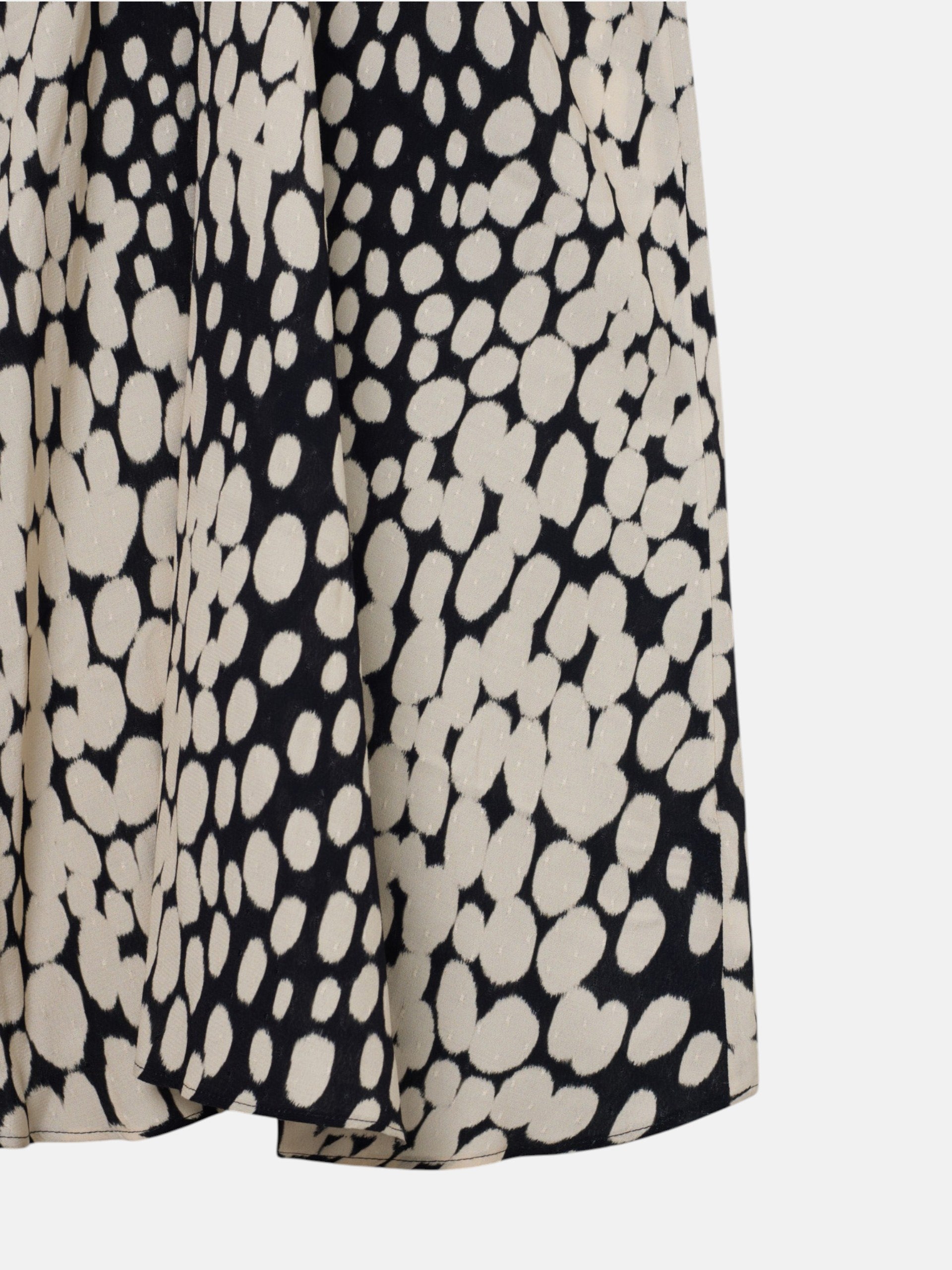 White and black polka dot draped midi dress