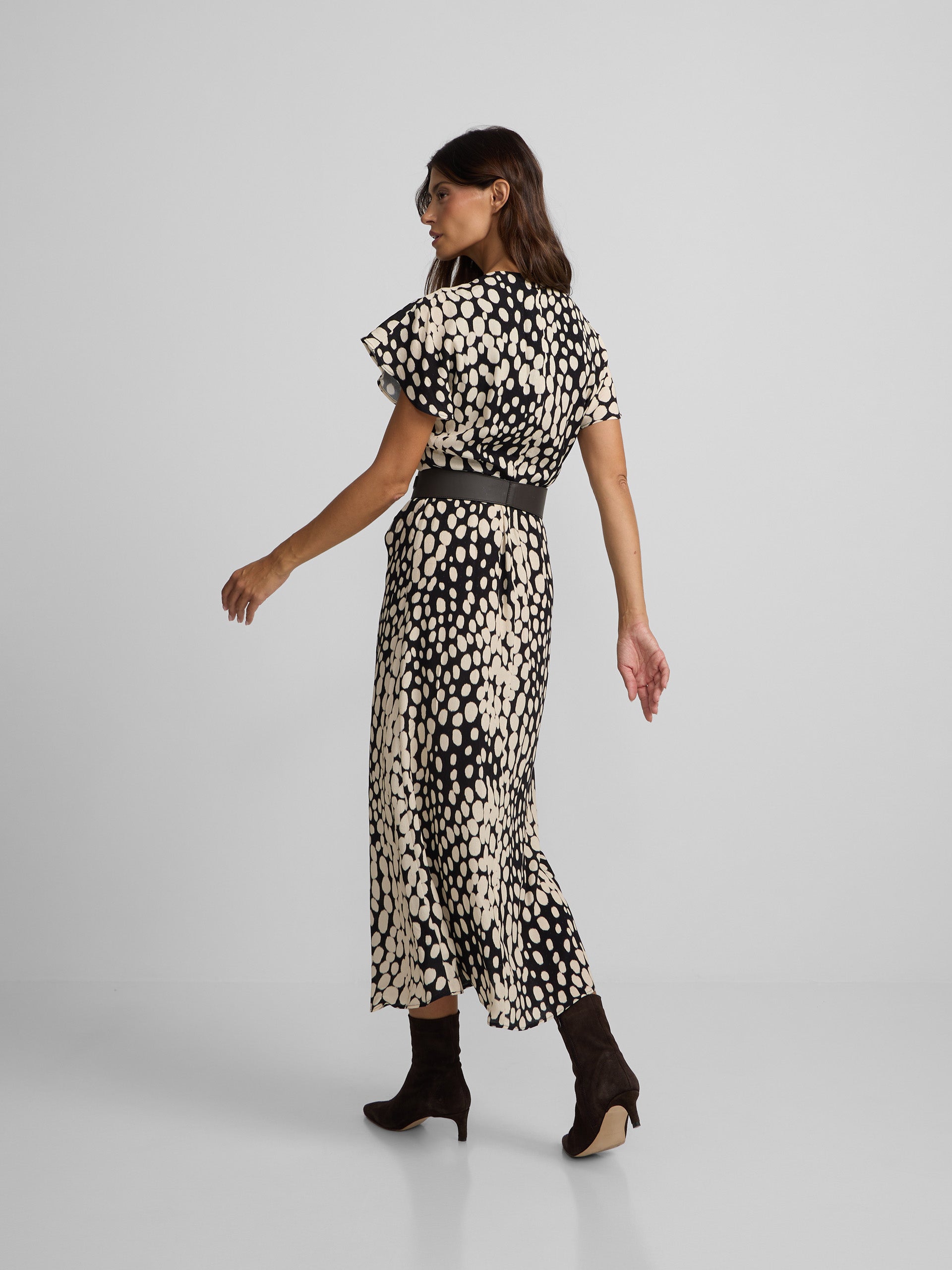 White and black polka dot draped midi dress