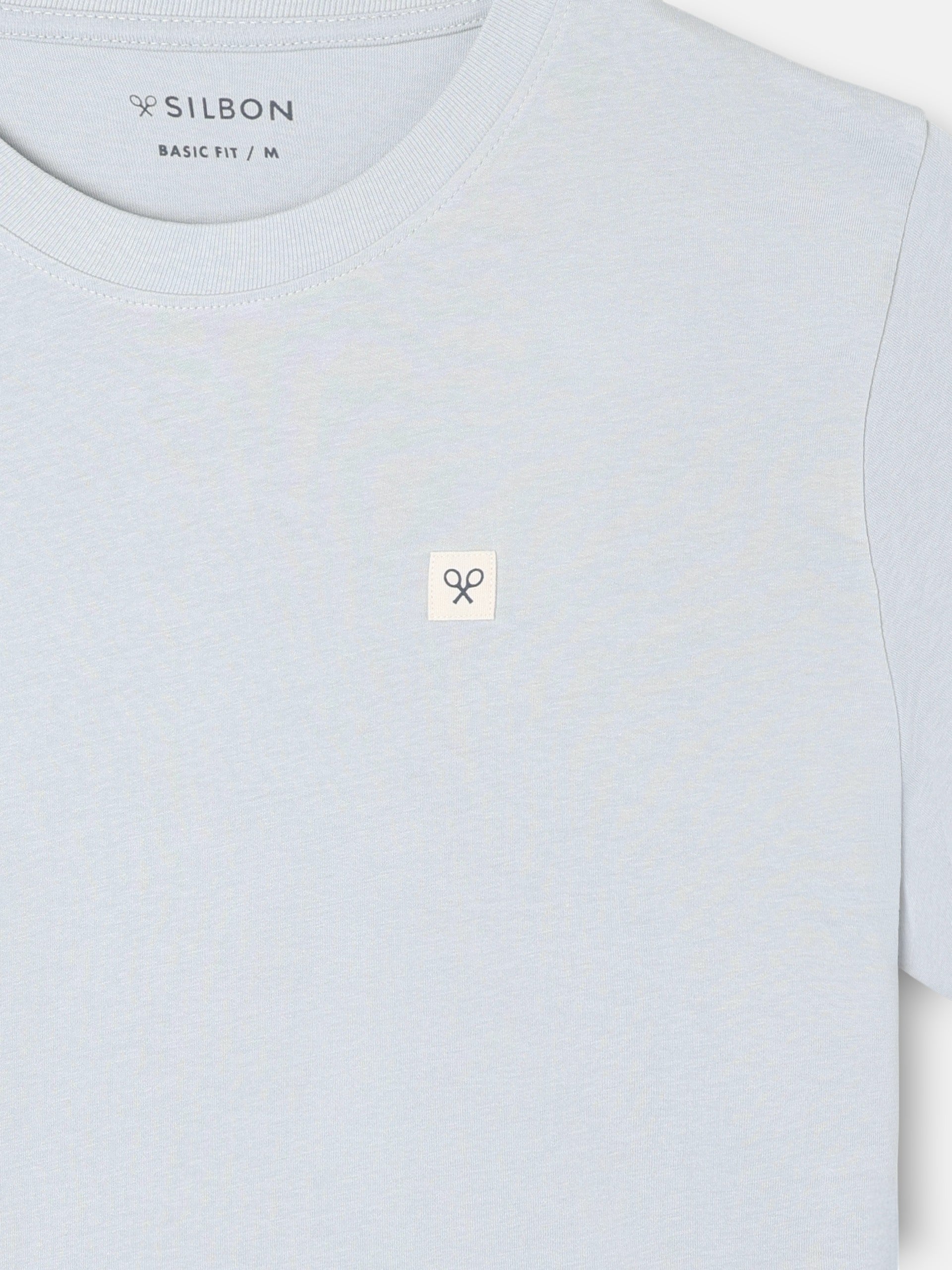 Camiseta lisa minilogo parche azul claro