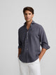 Chemise sport bleue à poche usée