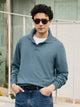 Pull col polo bleu pétrole