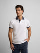 Polo manga corta ribete azul marino blanco