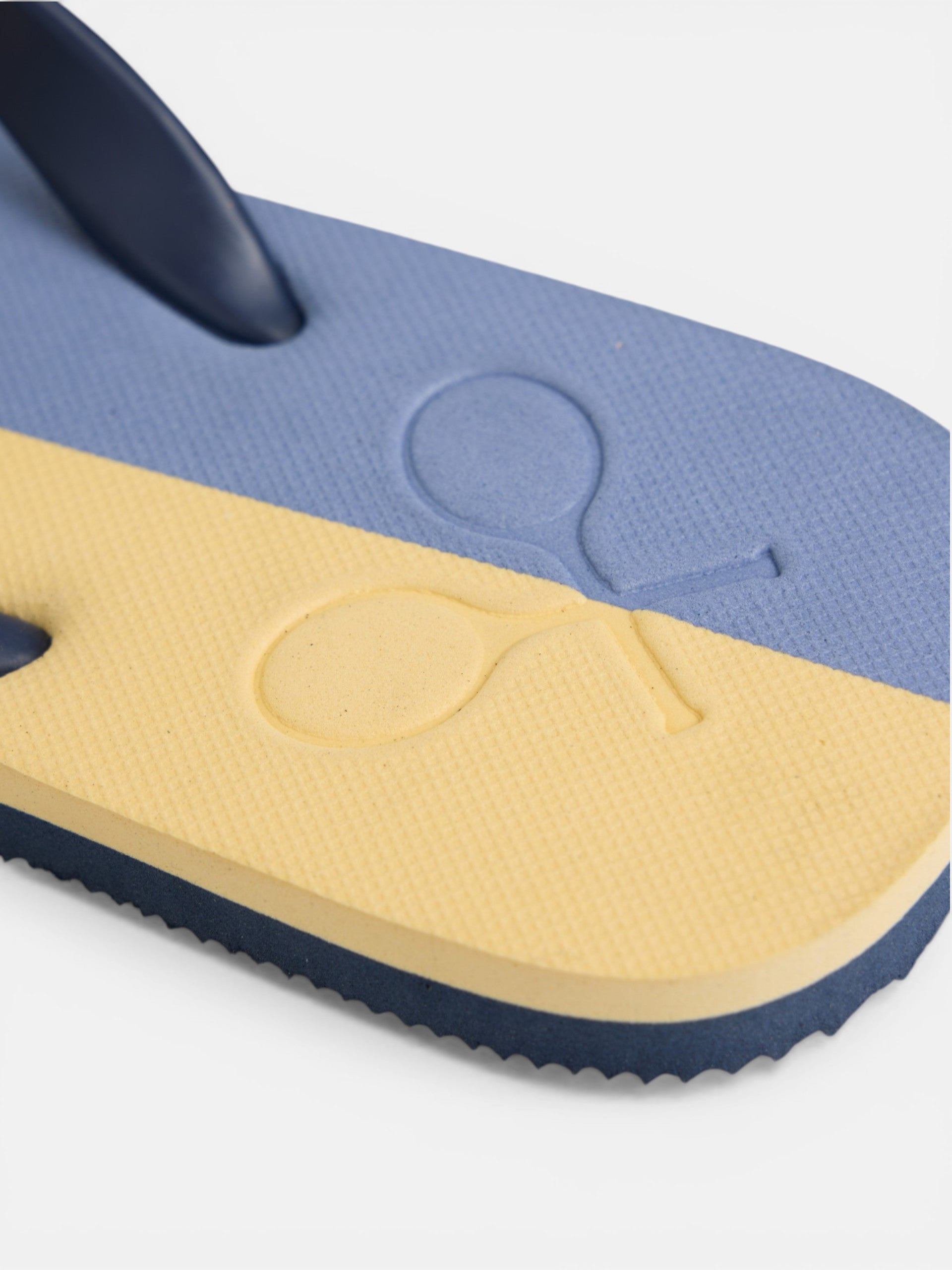 Two-tone yellow paddle flip-flops