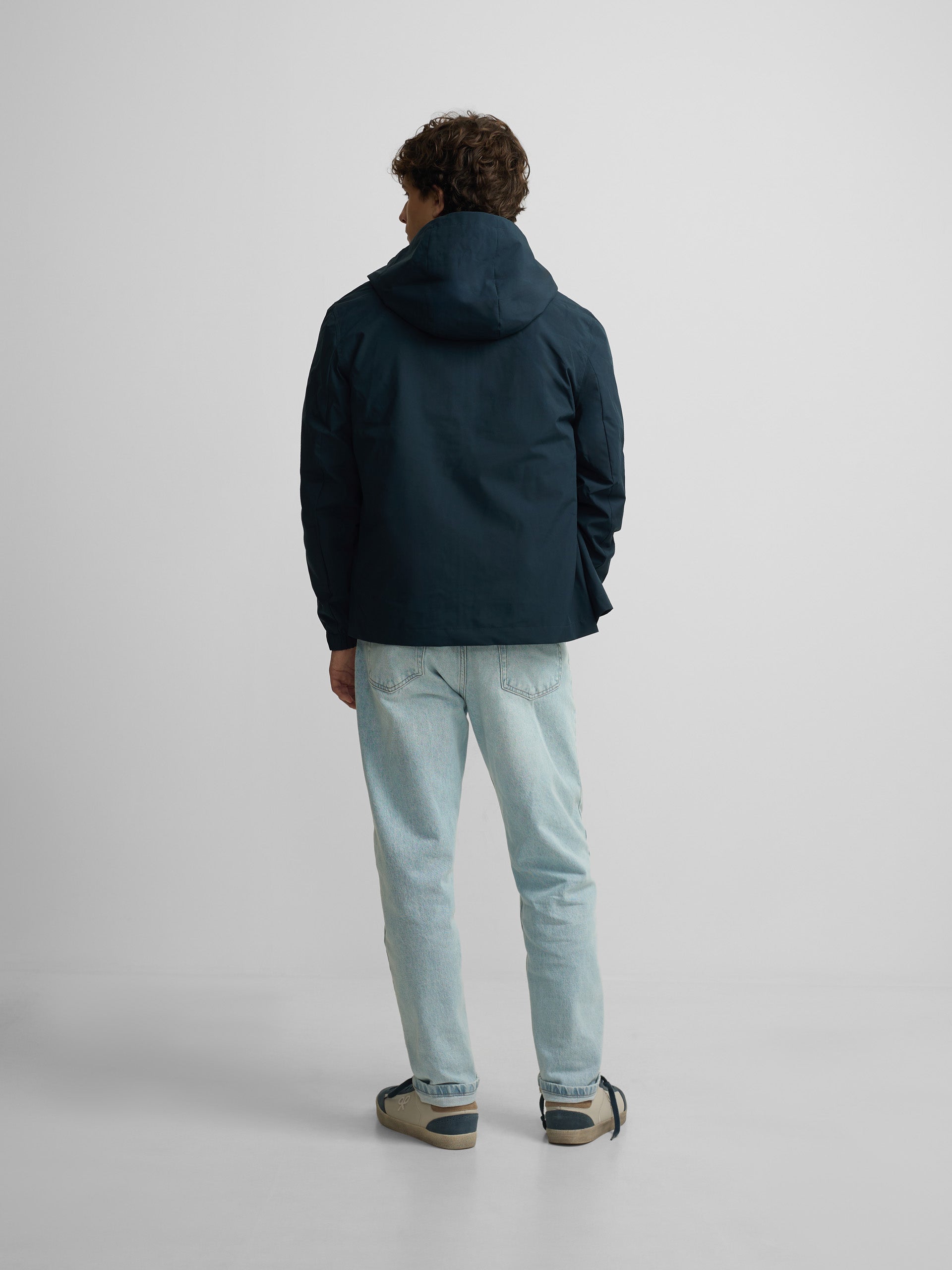 Technical windbreaker with navy blue hood