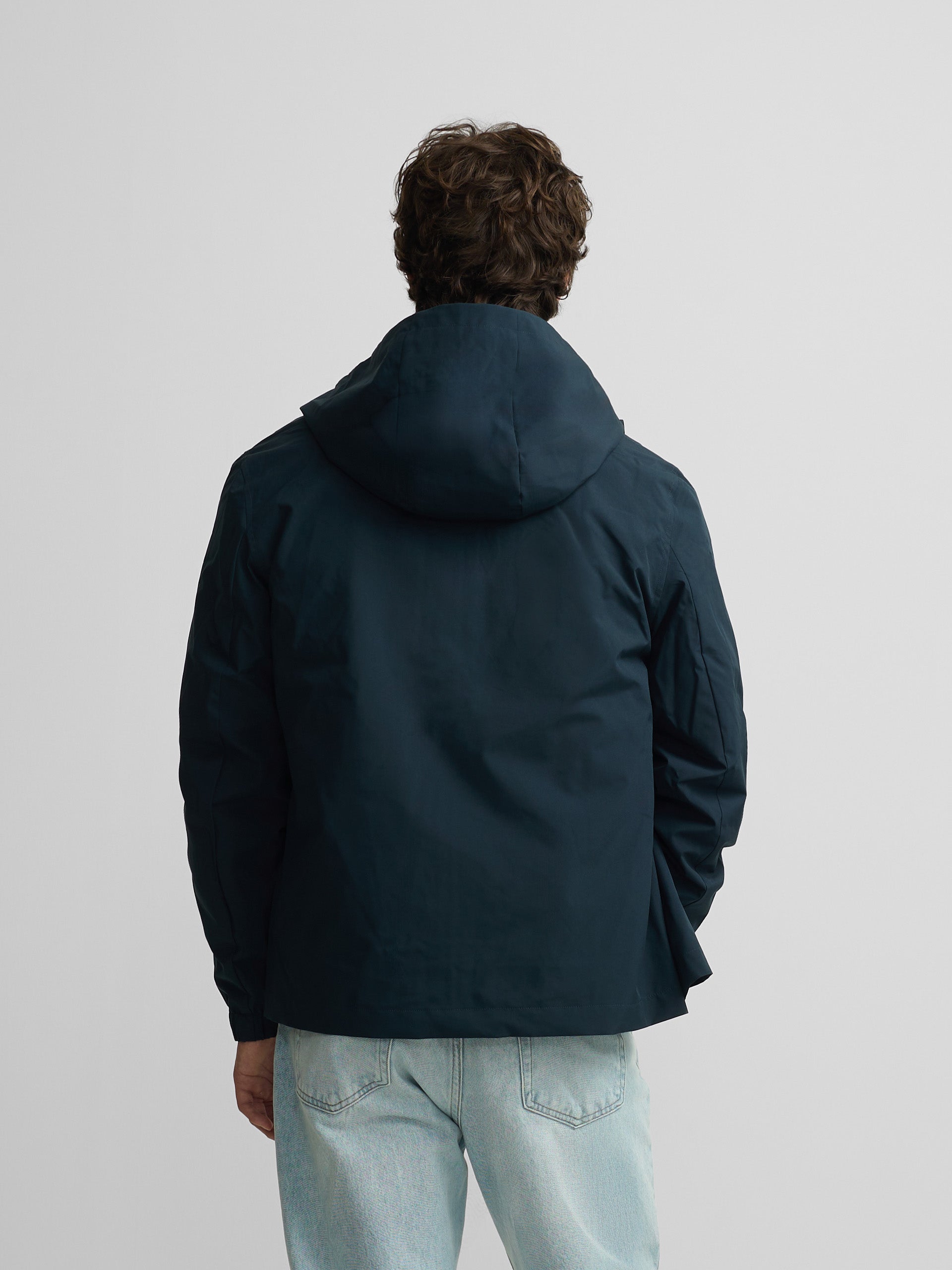 Technical windbreaker with navy blue hood