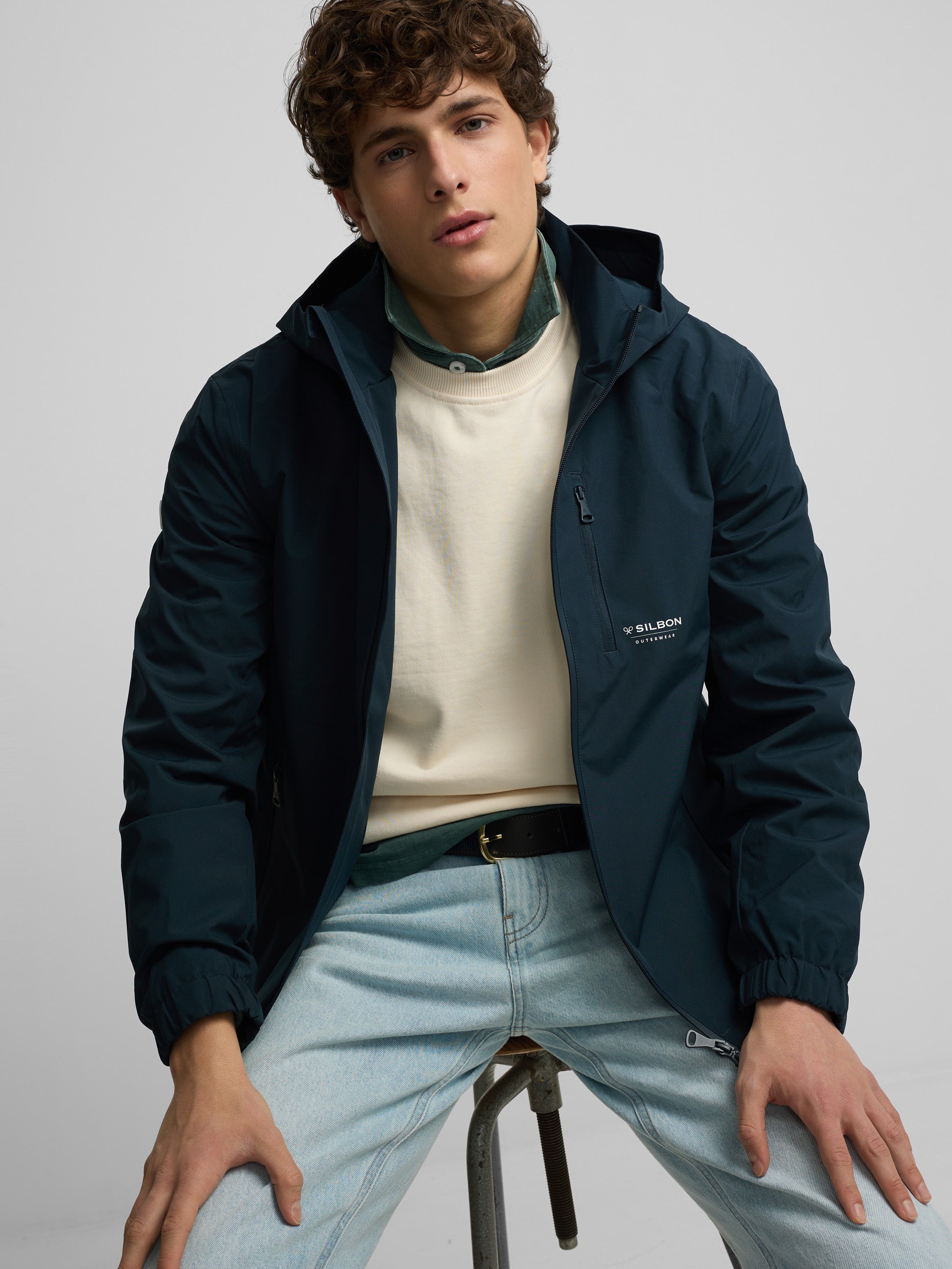 Technical windbreaker with navy blue hood