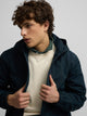 Technical windbreaker with navy blue hood