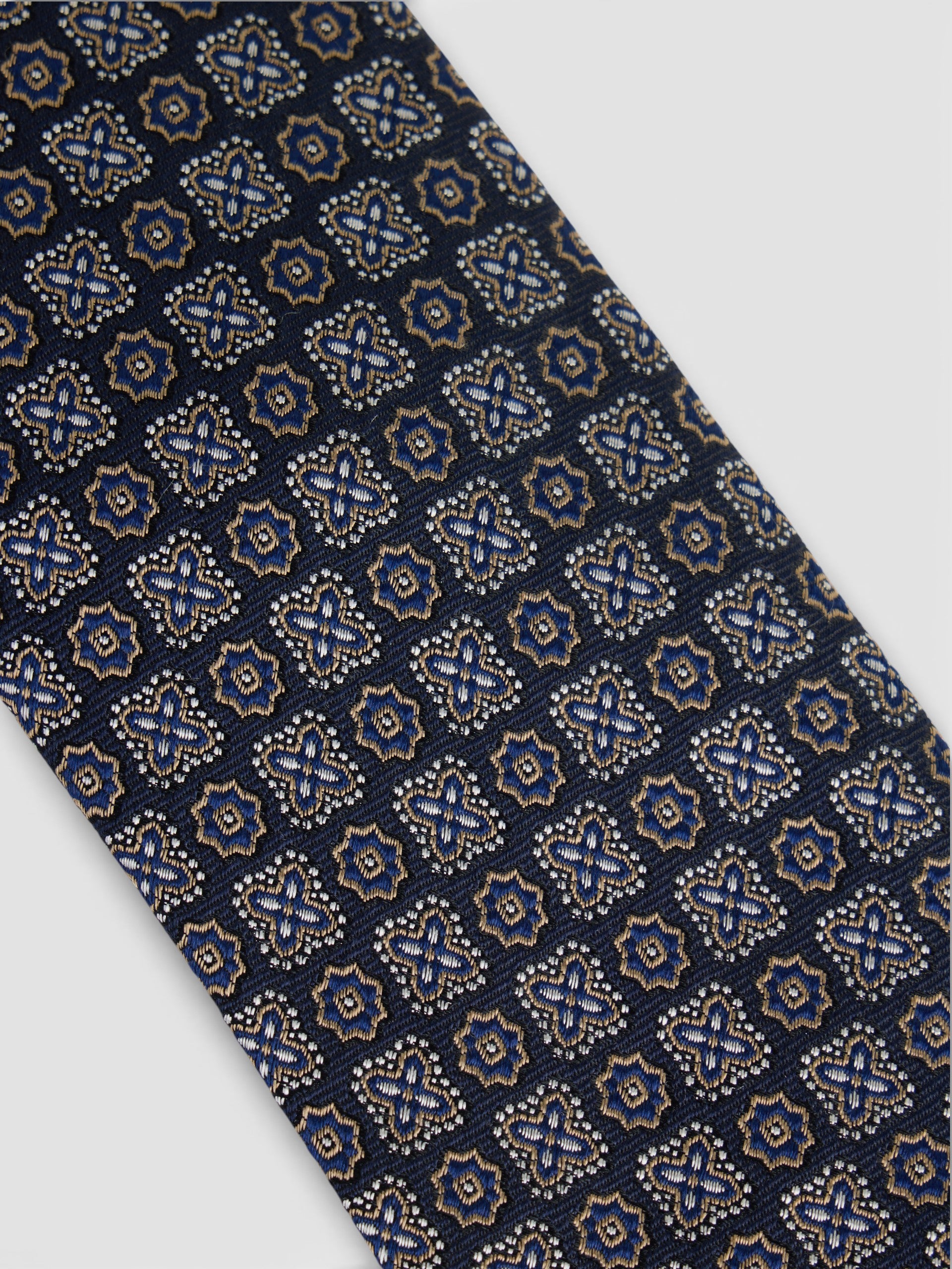 Corbata motivo flor azul marino