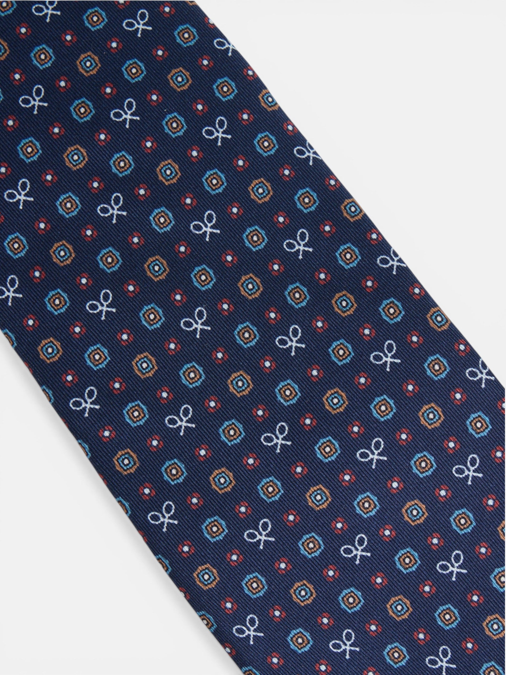 Corbata raquetas motivos geometricos azul marino