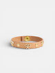 Pulseira de pele com logótipo e tachas natural