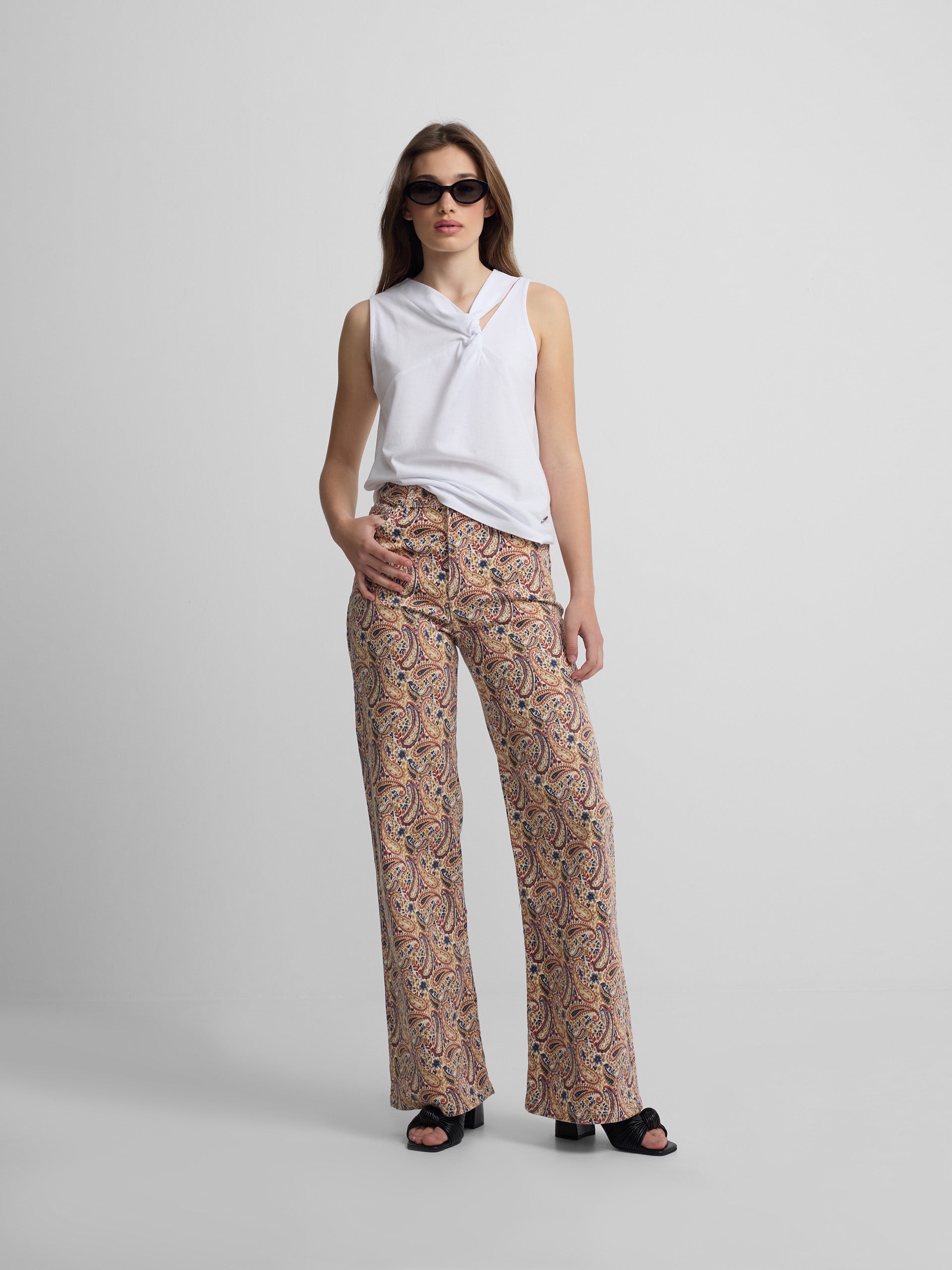 Printed denim trousers with orange paisley