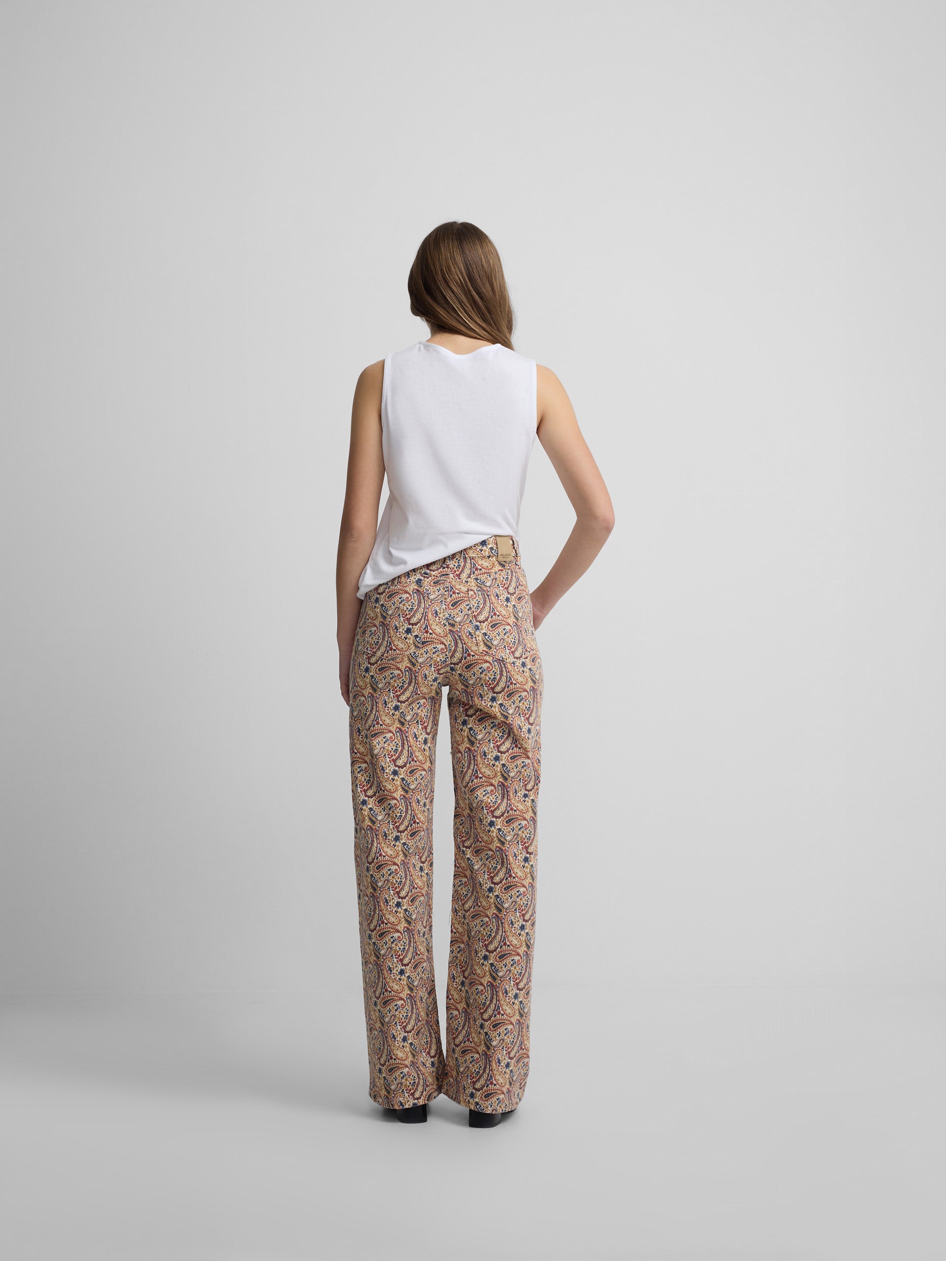 Printed denim trousers with orange paisley