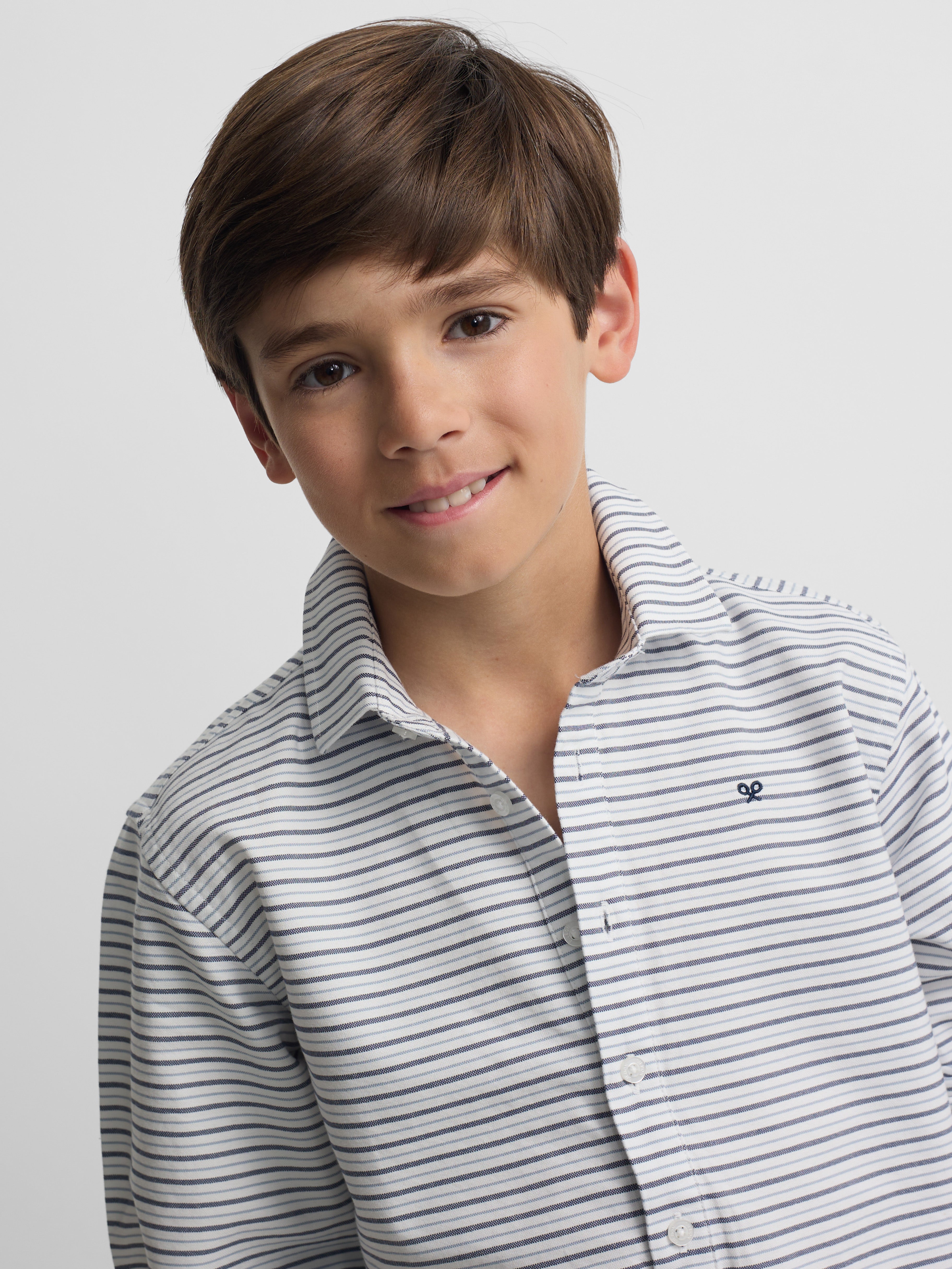 Polera sport kids oxford raya crema azul marino