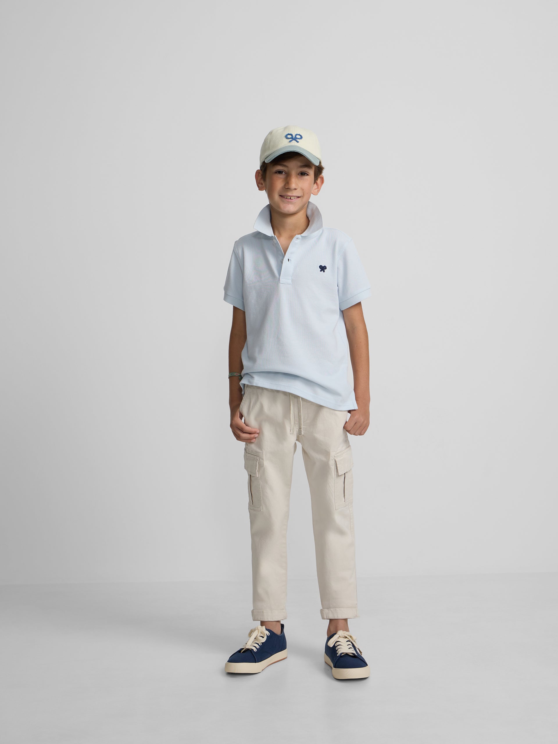 Polo kids liso logo rizo azul claro