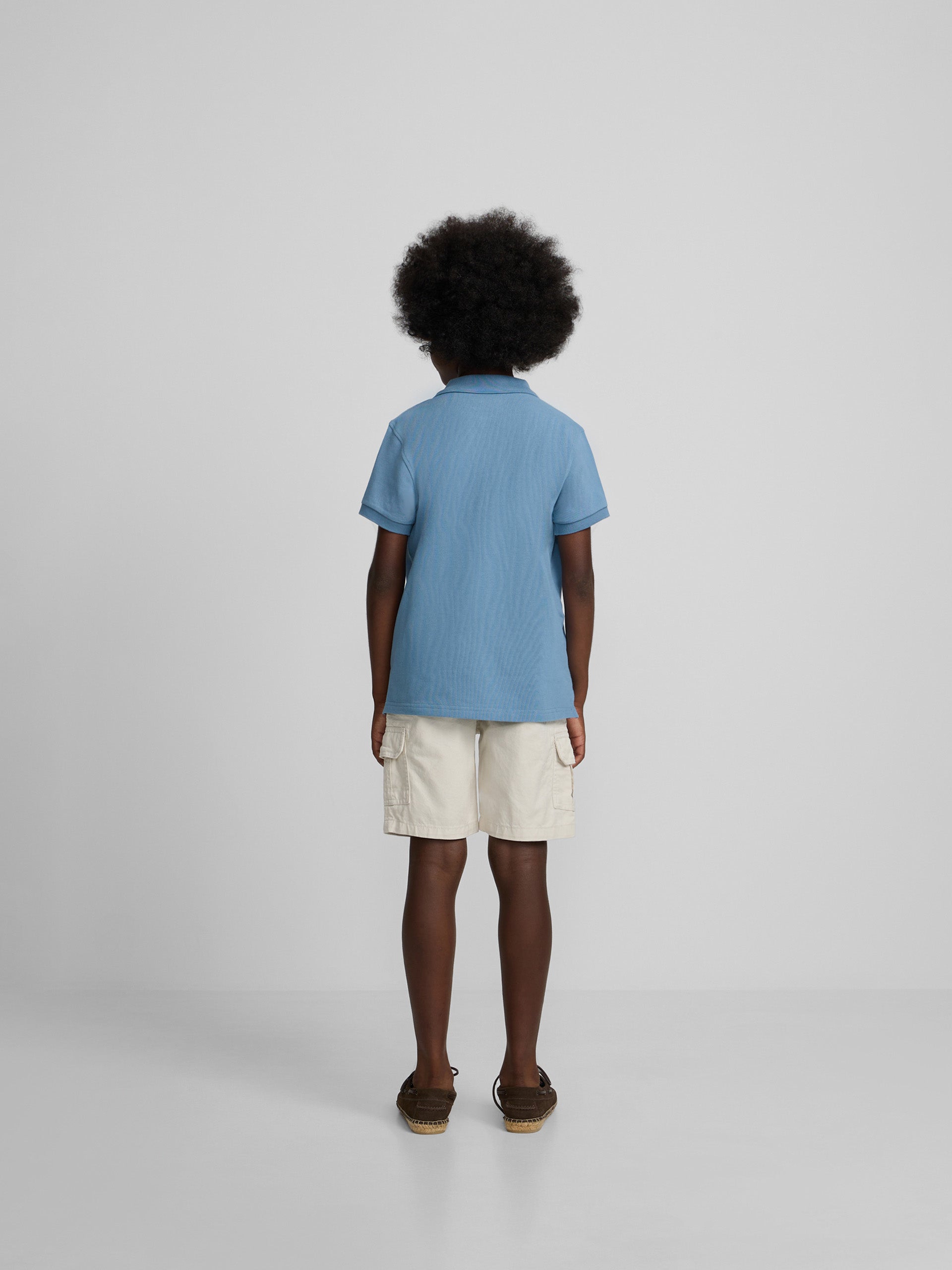 Polo kids liso logo rizo azul medio