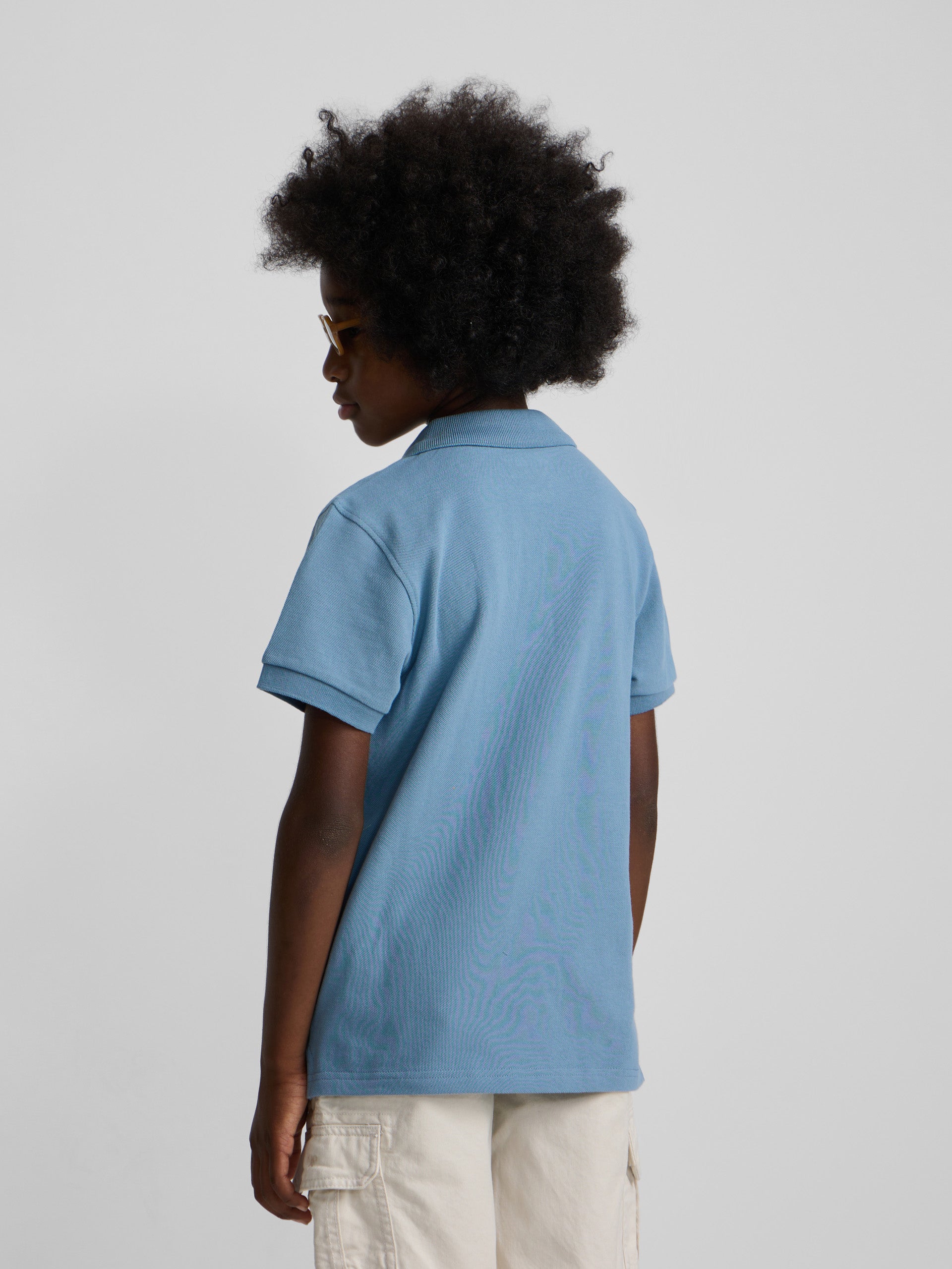 Polo kids liso logo rizo azul medio