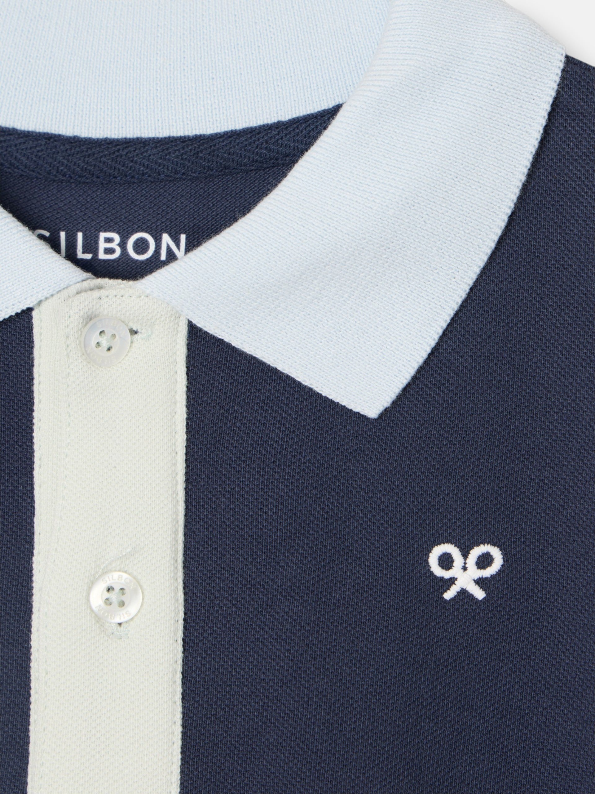 Polo kids ribete multicolor azul marino
