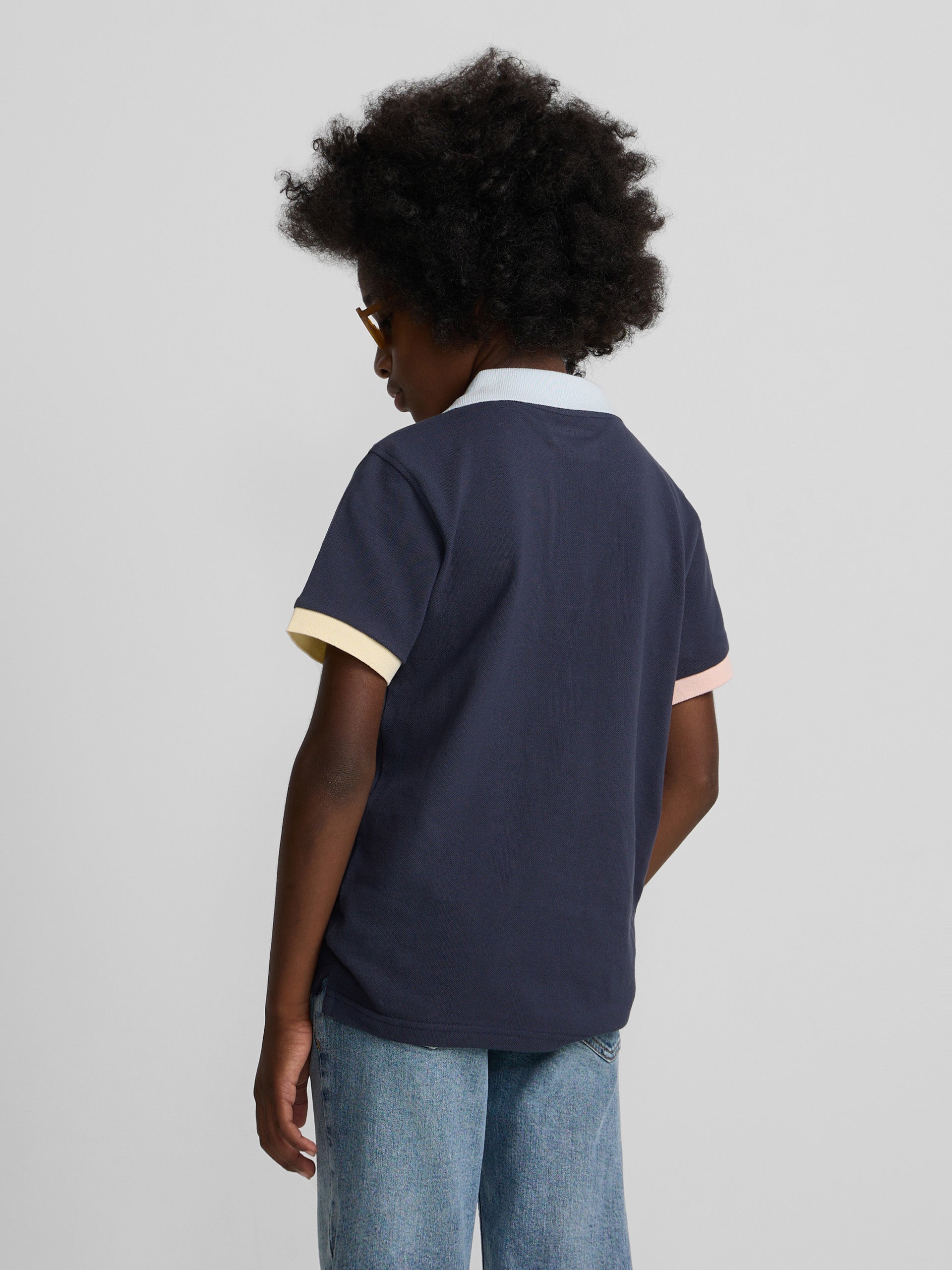 Polo kids ribete multicolor azul marino