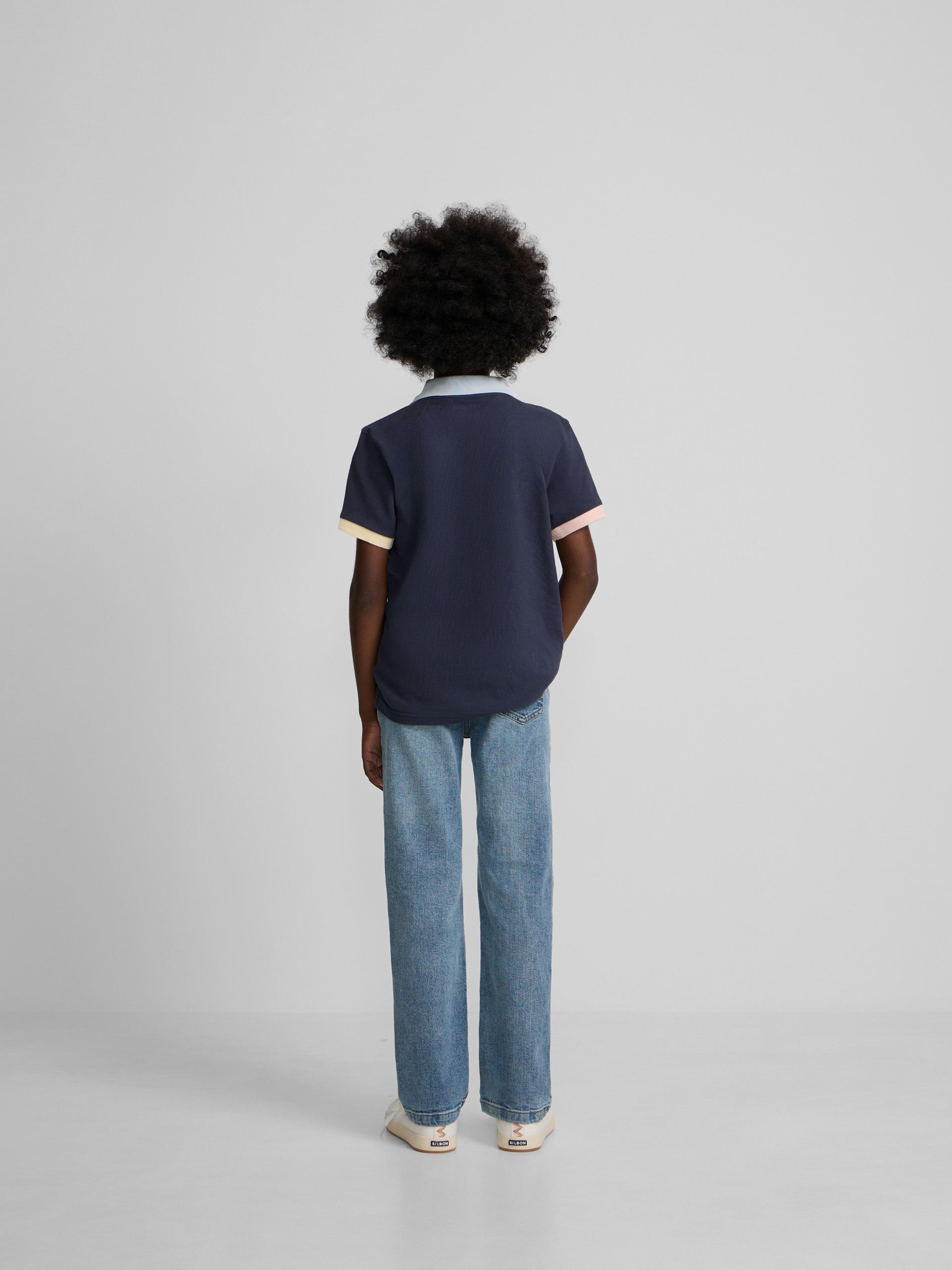 Polo kids ribete multicolor azul marino
