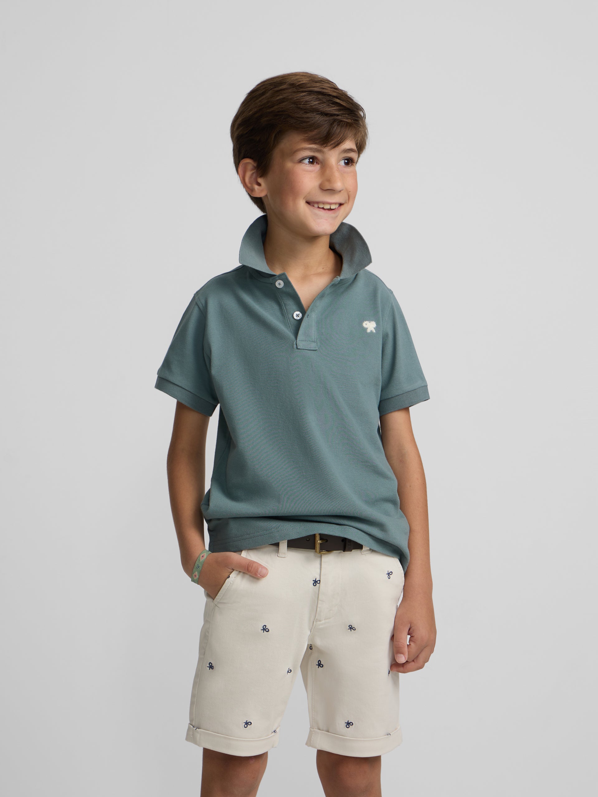 Polo kids liso logo rizo verde oscuro