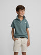 Polo kids liso logo rizo verde oscuro