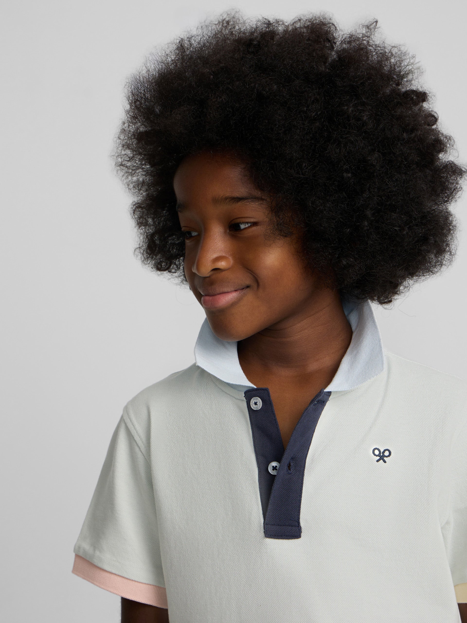 Polo enfant à liseré multicolore vert clair