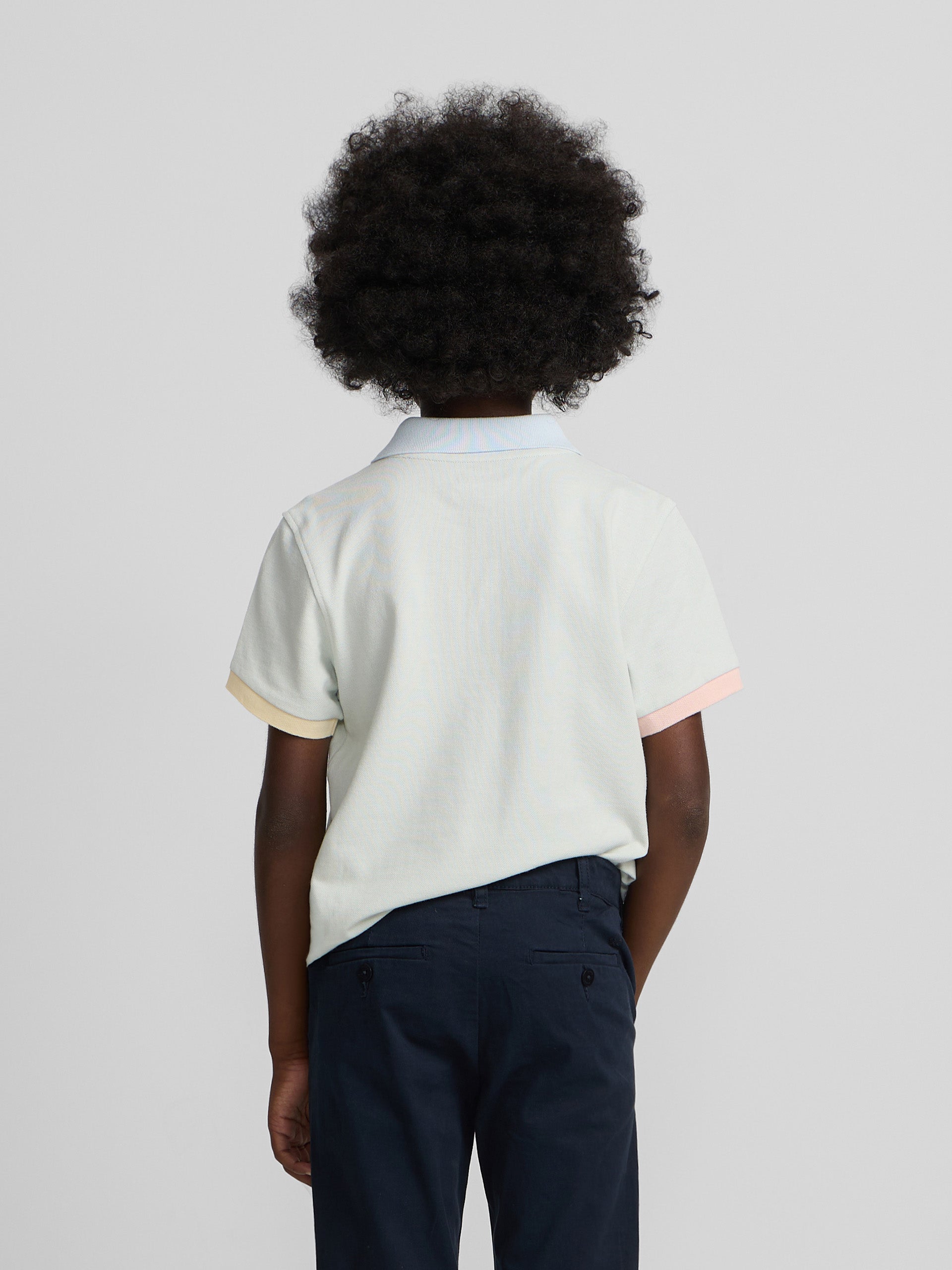 Polo enfant à liseré multicolore vert clair