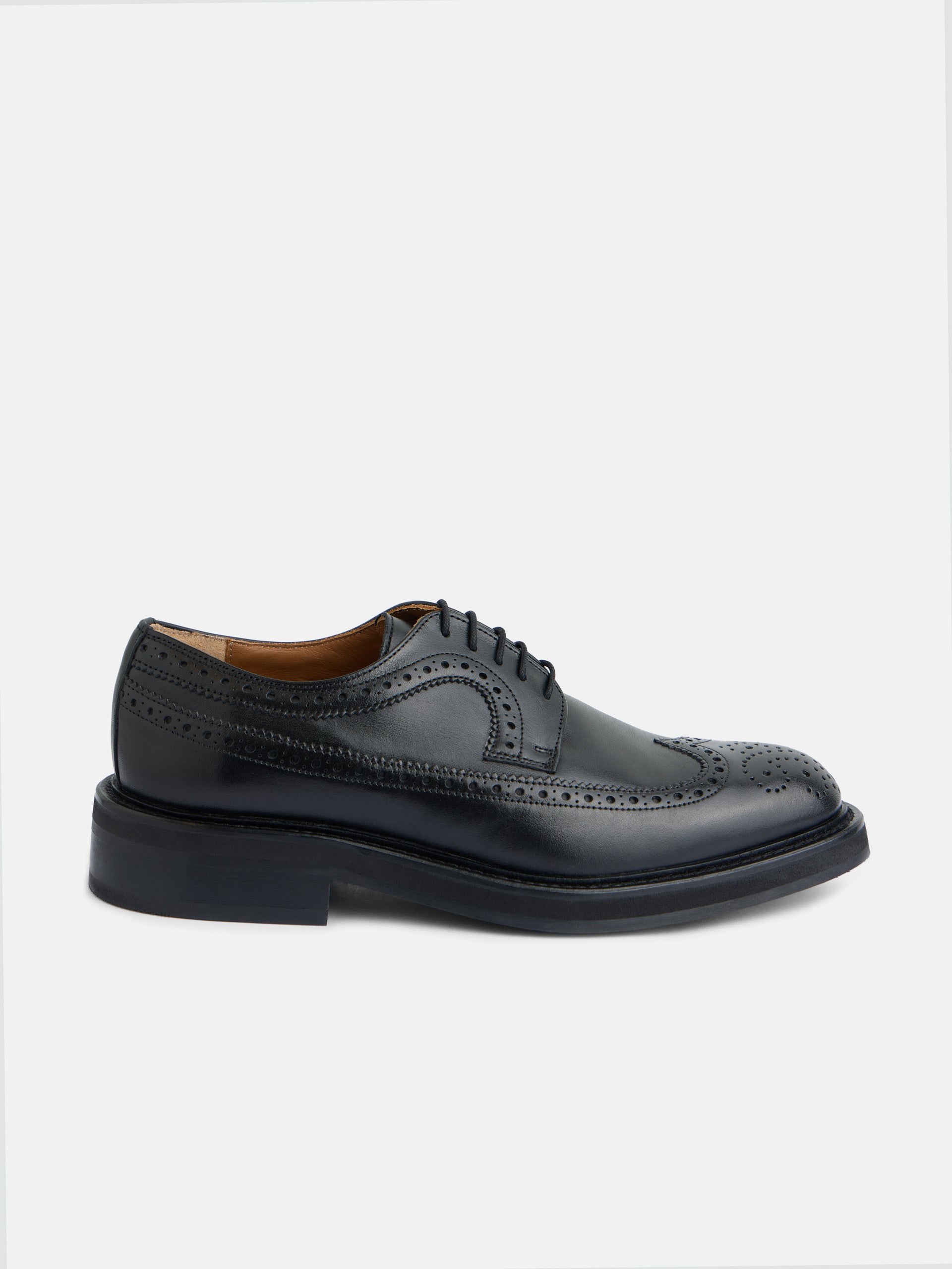 Classic perforated black leather shoe