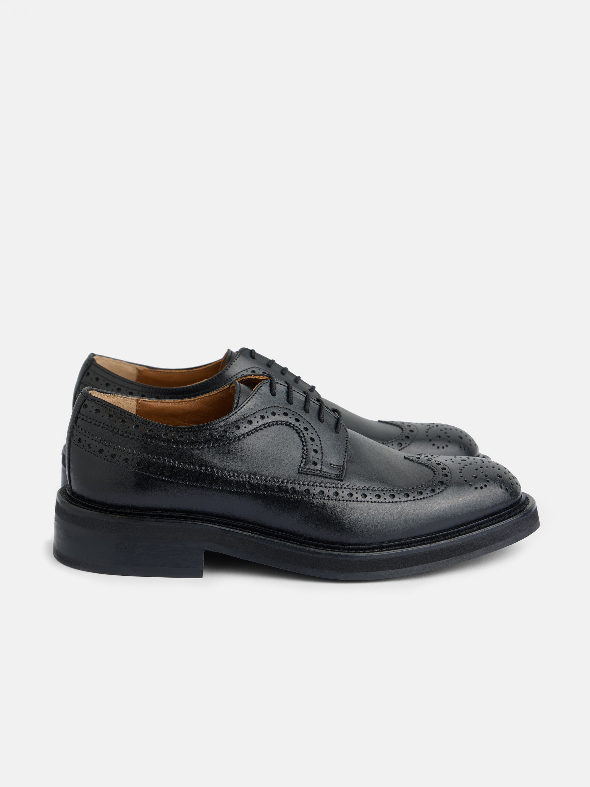 Classic perforated black leather shoe