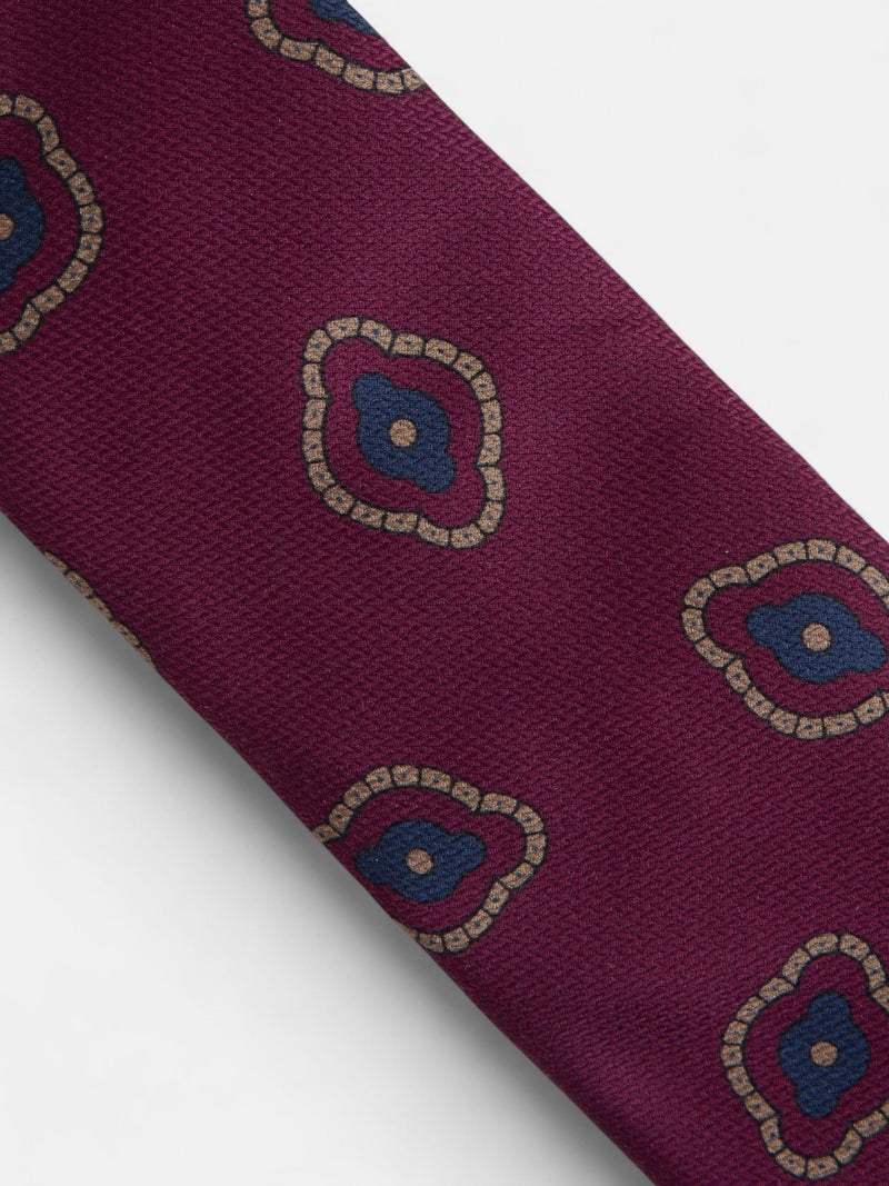 Burgundy tie with irregular geometric pattern