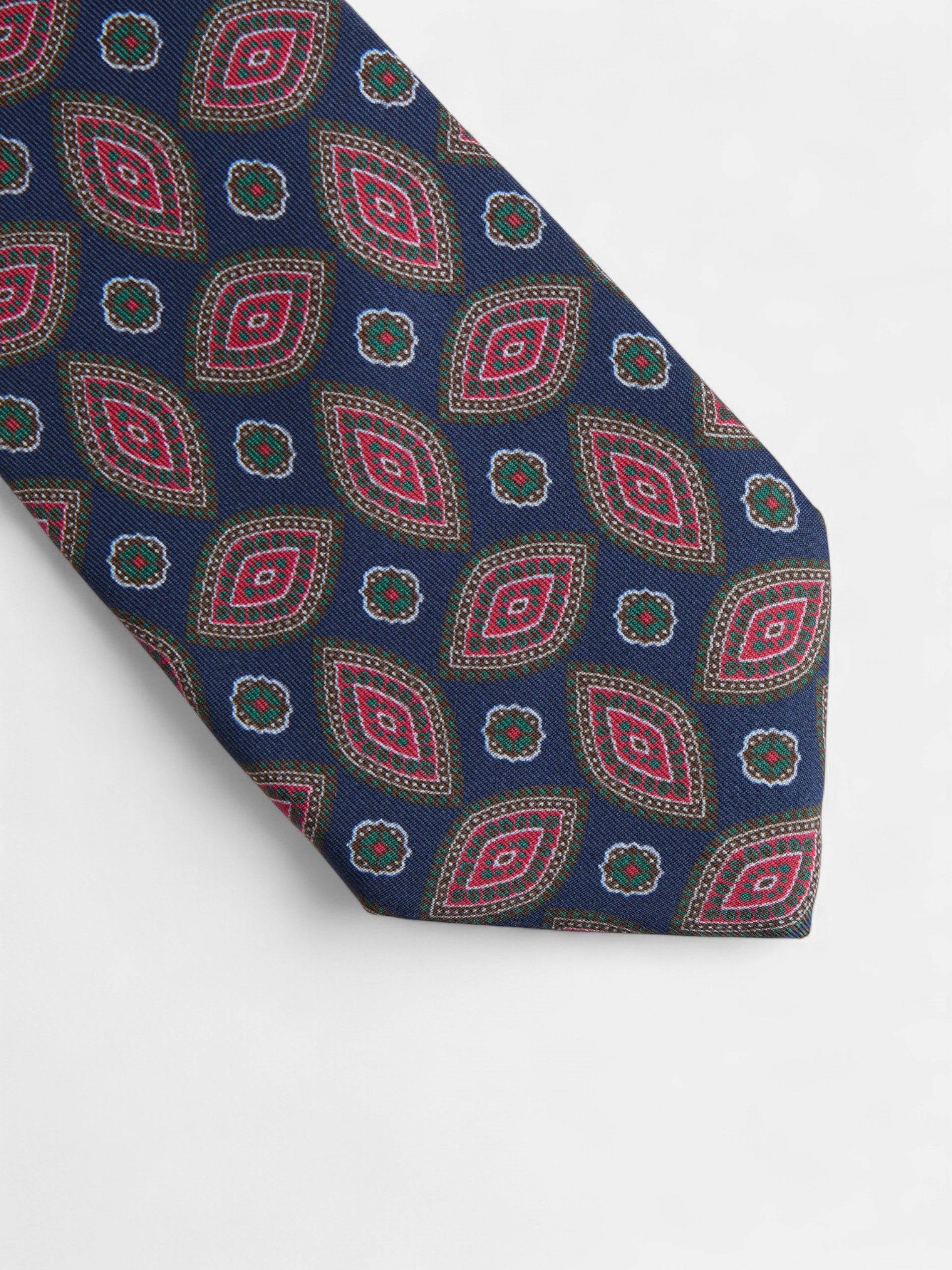 Vintage tie with navy blue oval pattern