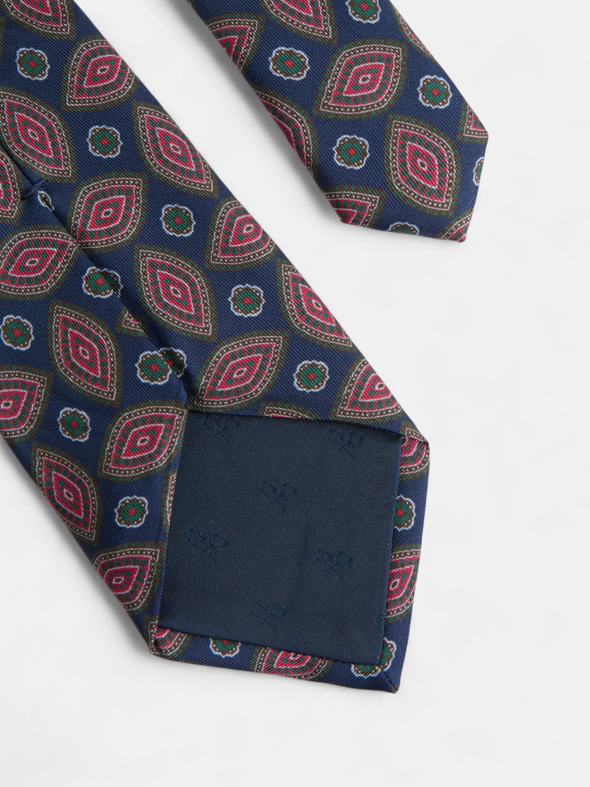 Vintage tie with navy blue oval pattern