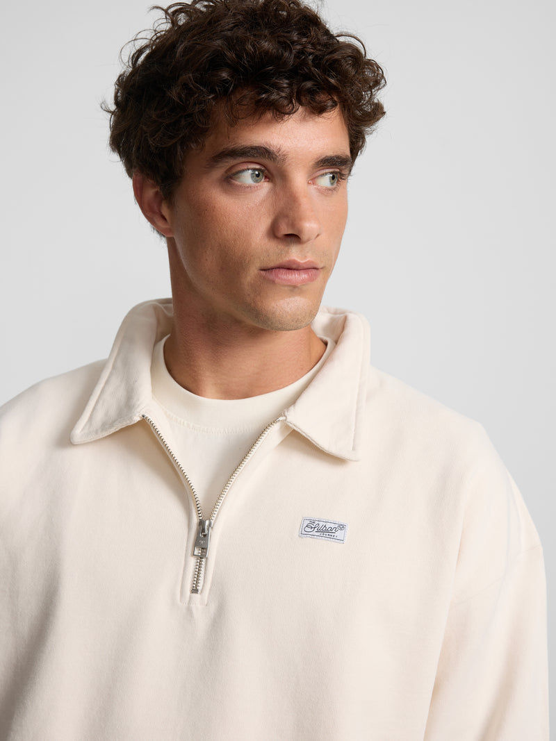 Sudadera relaxed fit media cremallera etiqueta crema