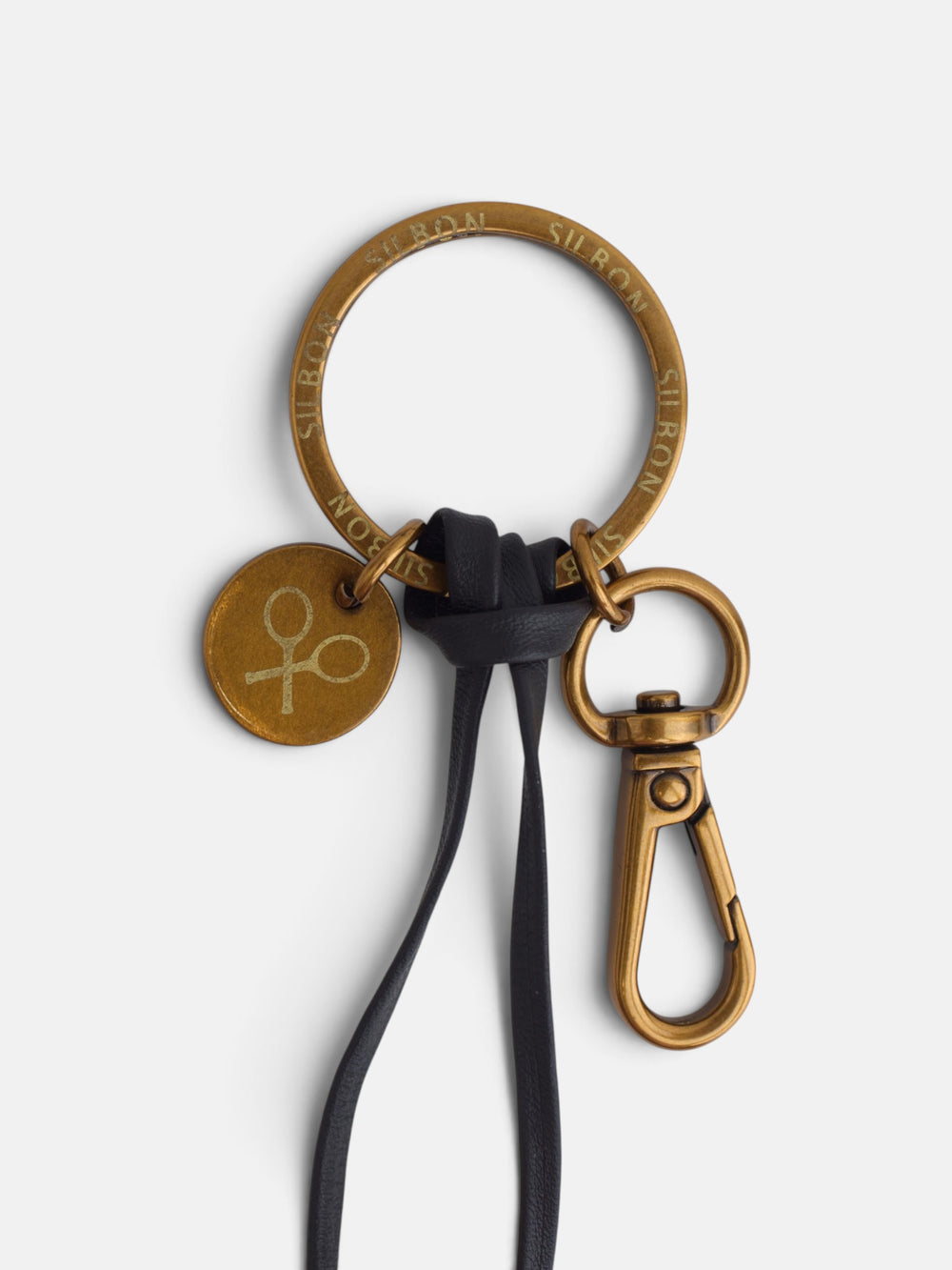 Llavero piel flores marron