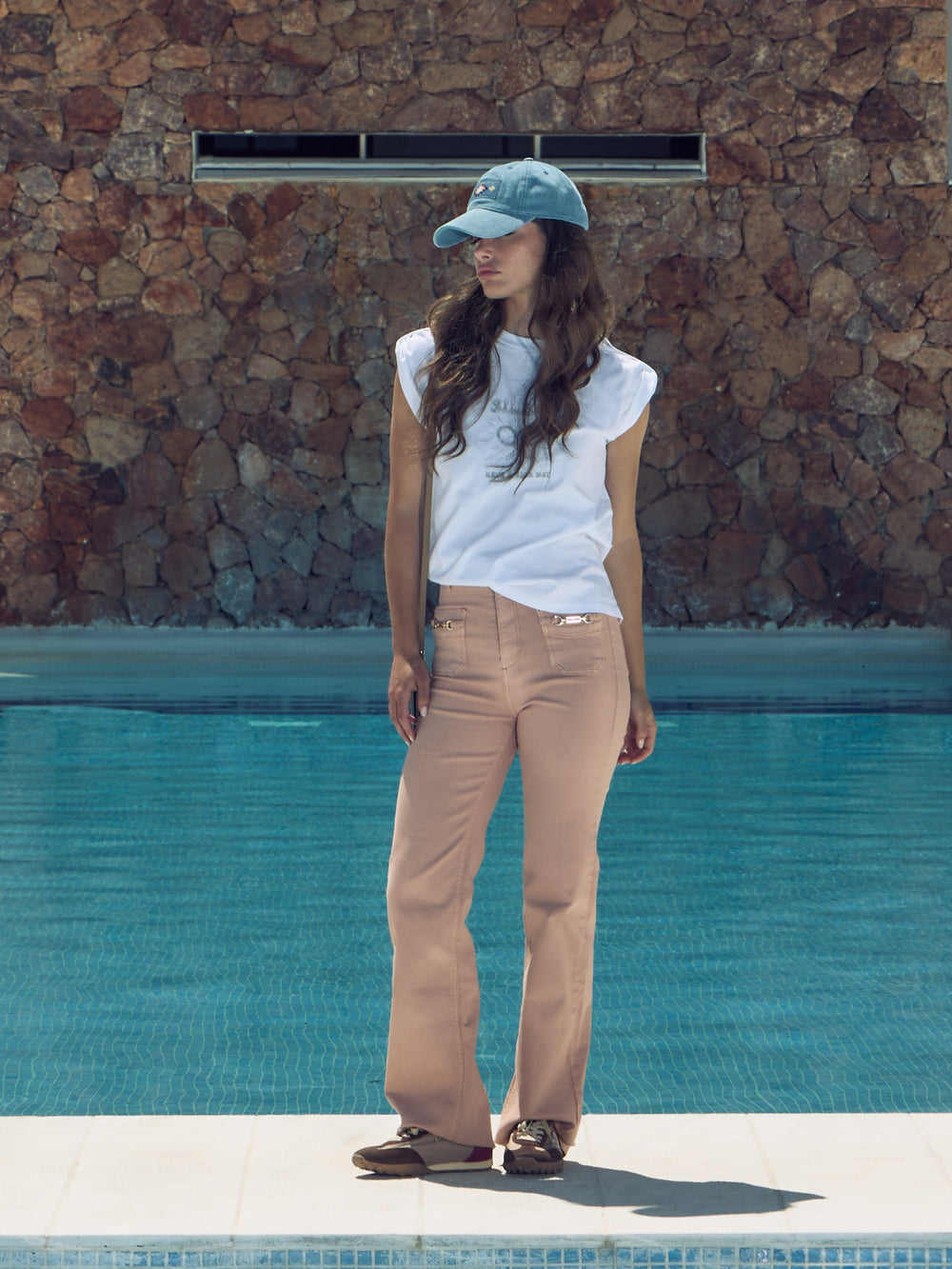 Coral denim trousers with buckles