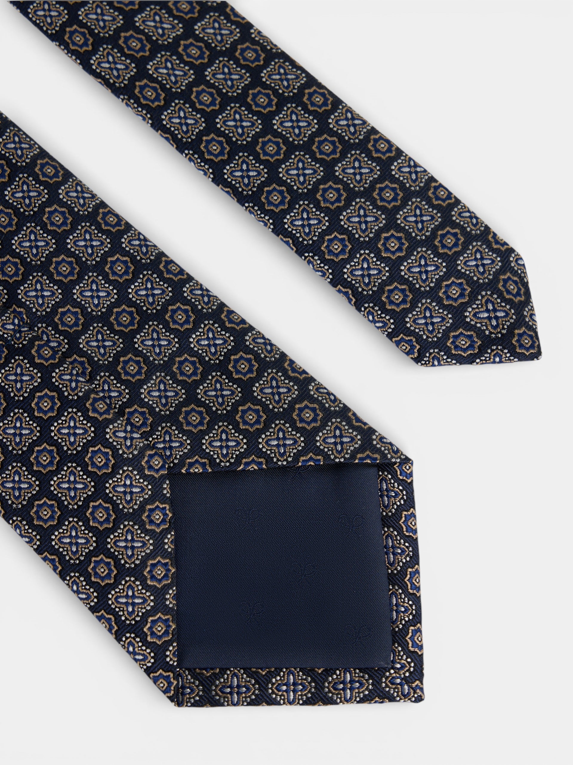 Corbata motivo flor azul marino