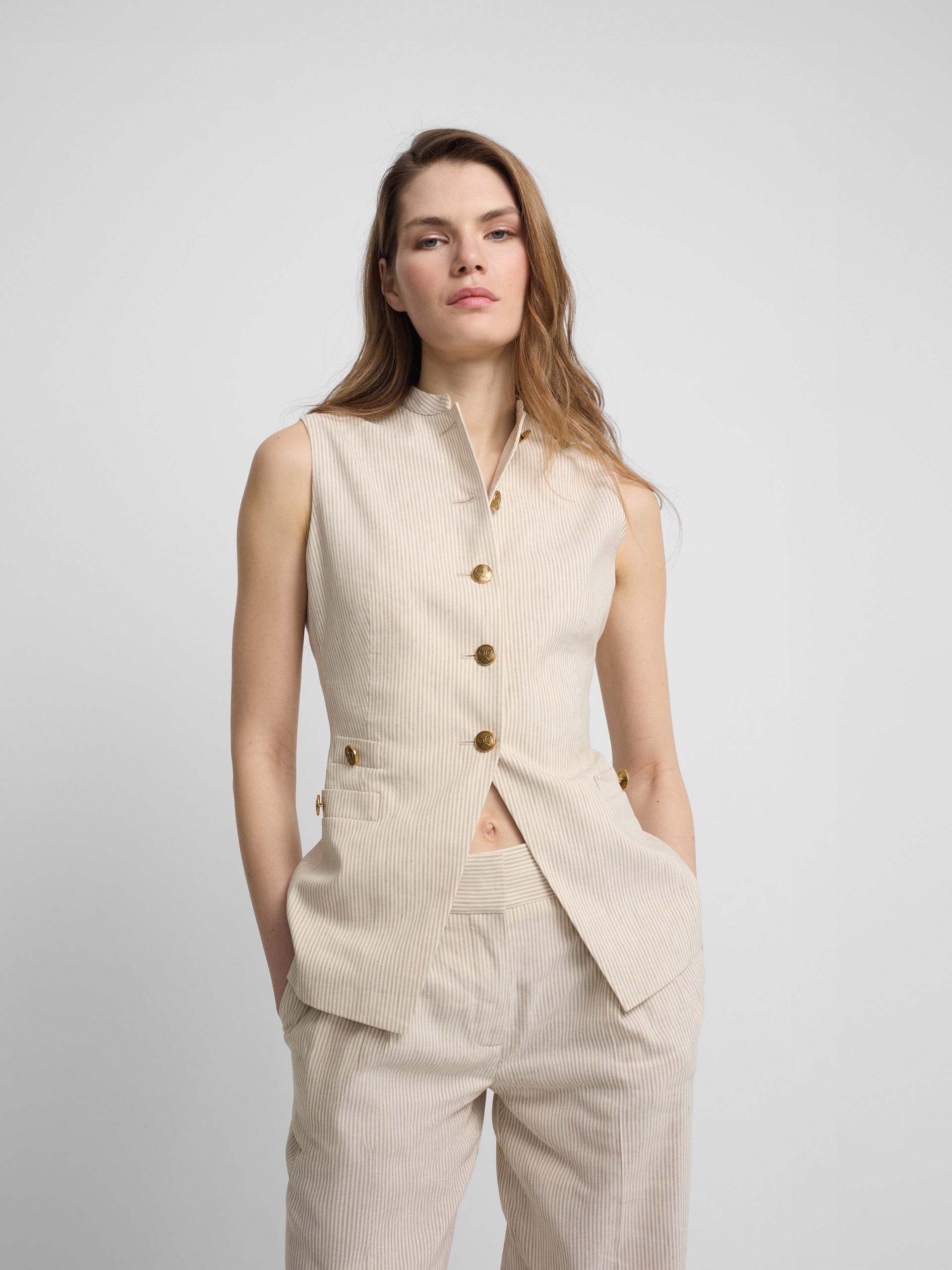 Chaleco botones rayas beige