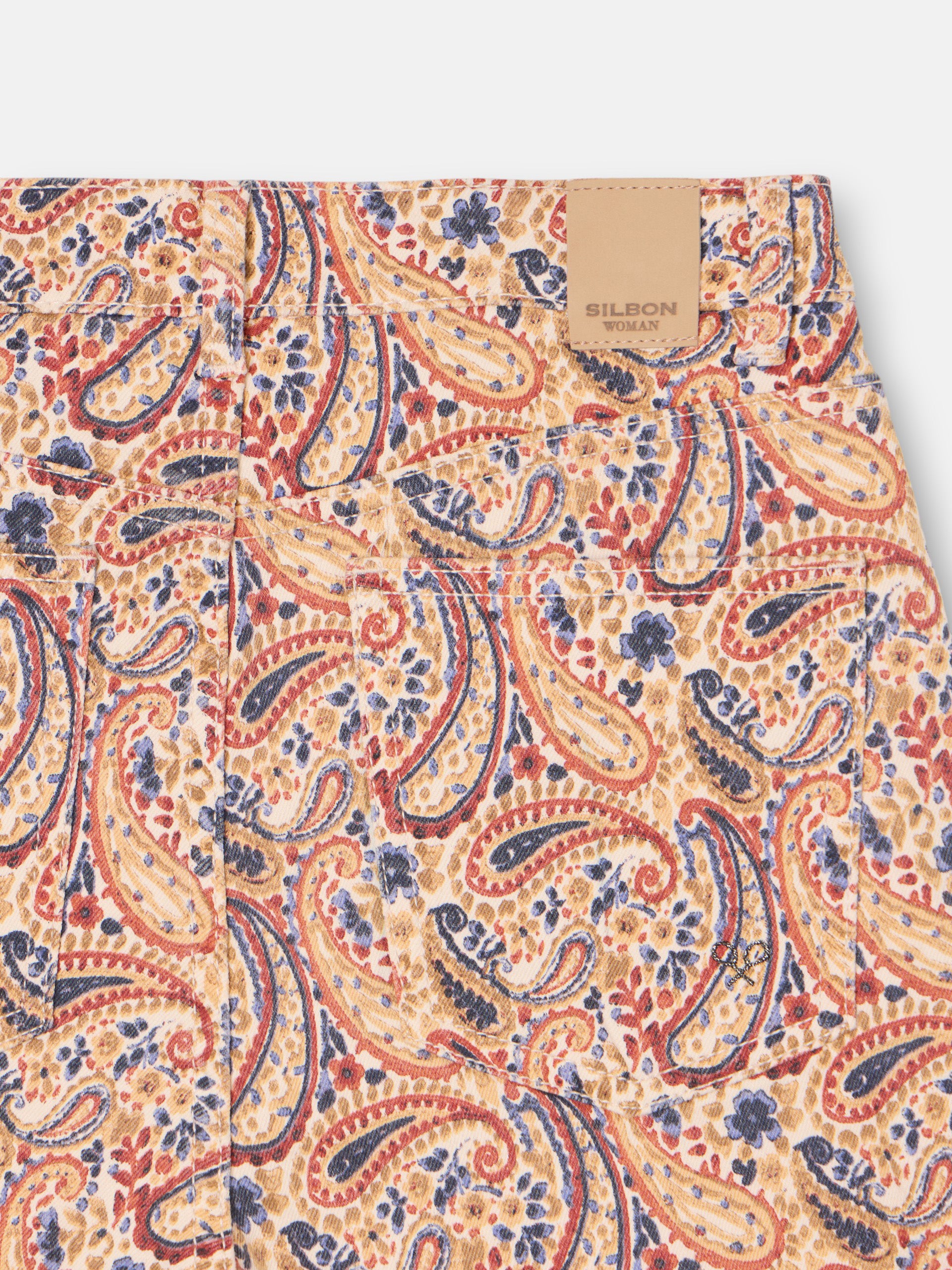 Printed denim trousers with orange paisley