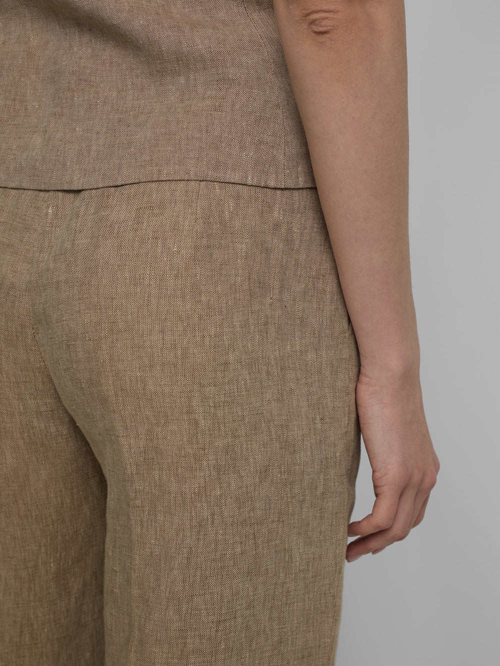 Straight beige trousers with slits