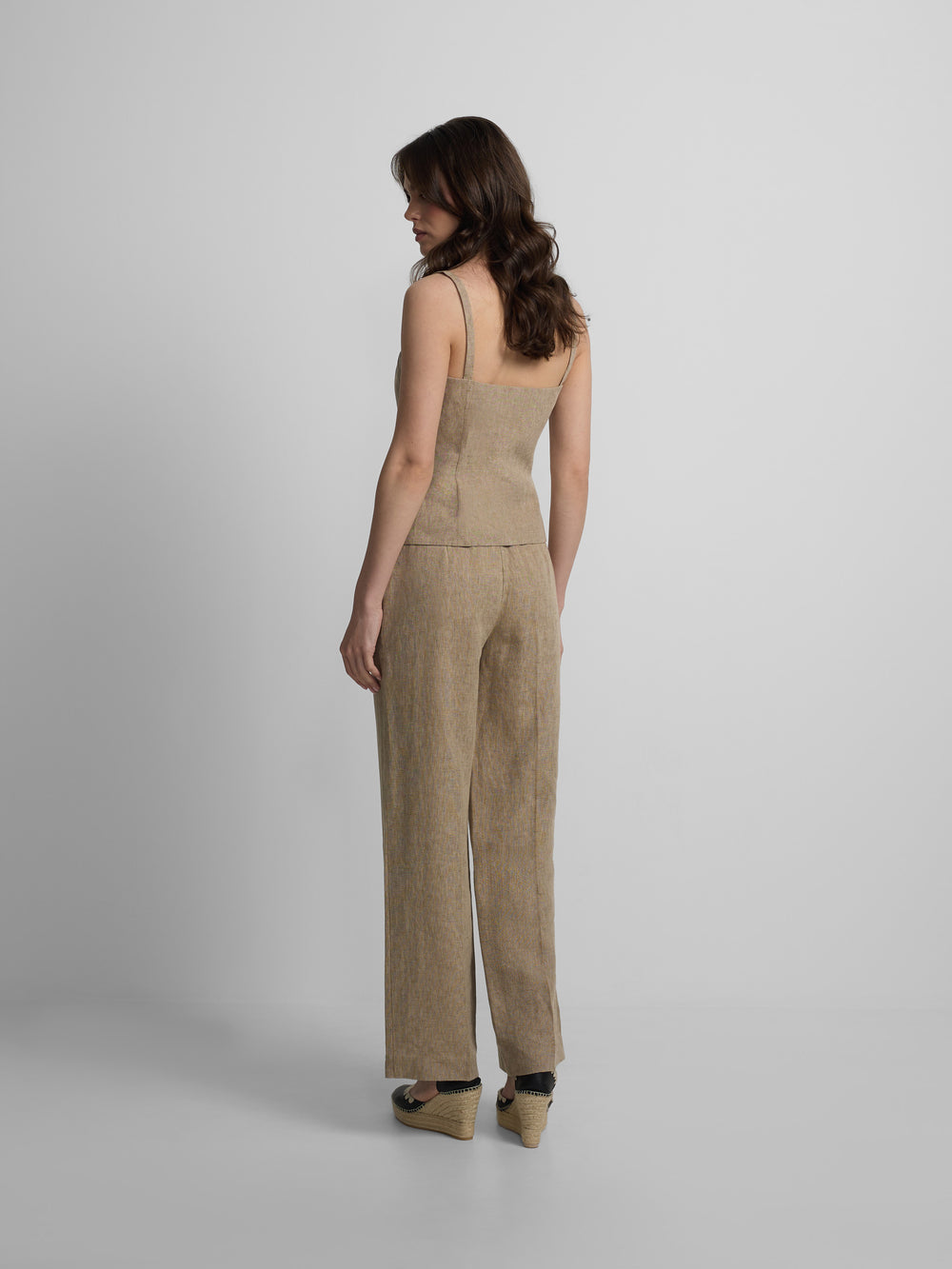 Straight beige trousers with slits