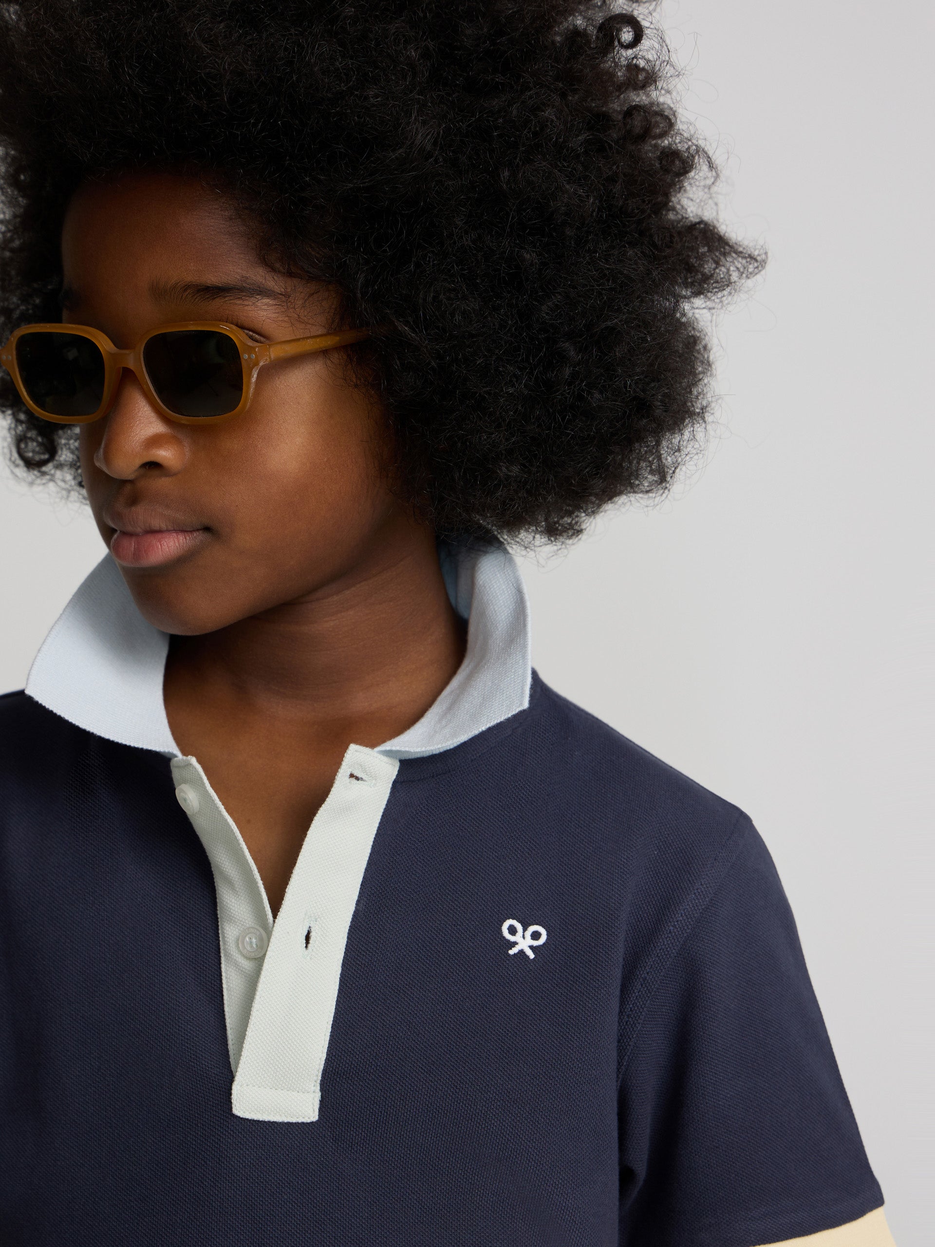 Polo kids ribete multicolor azul marino