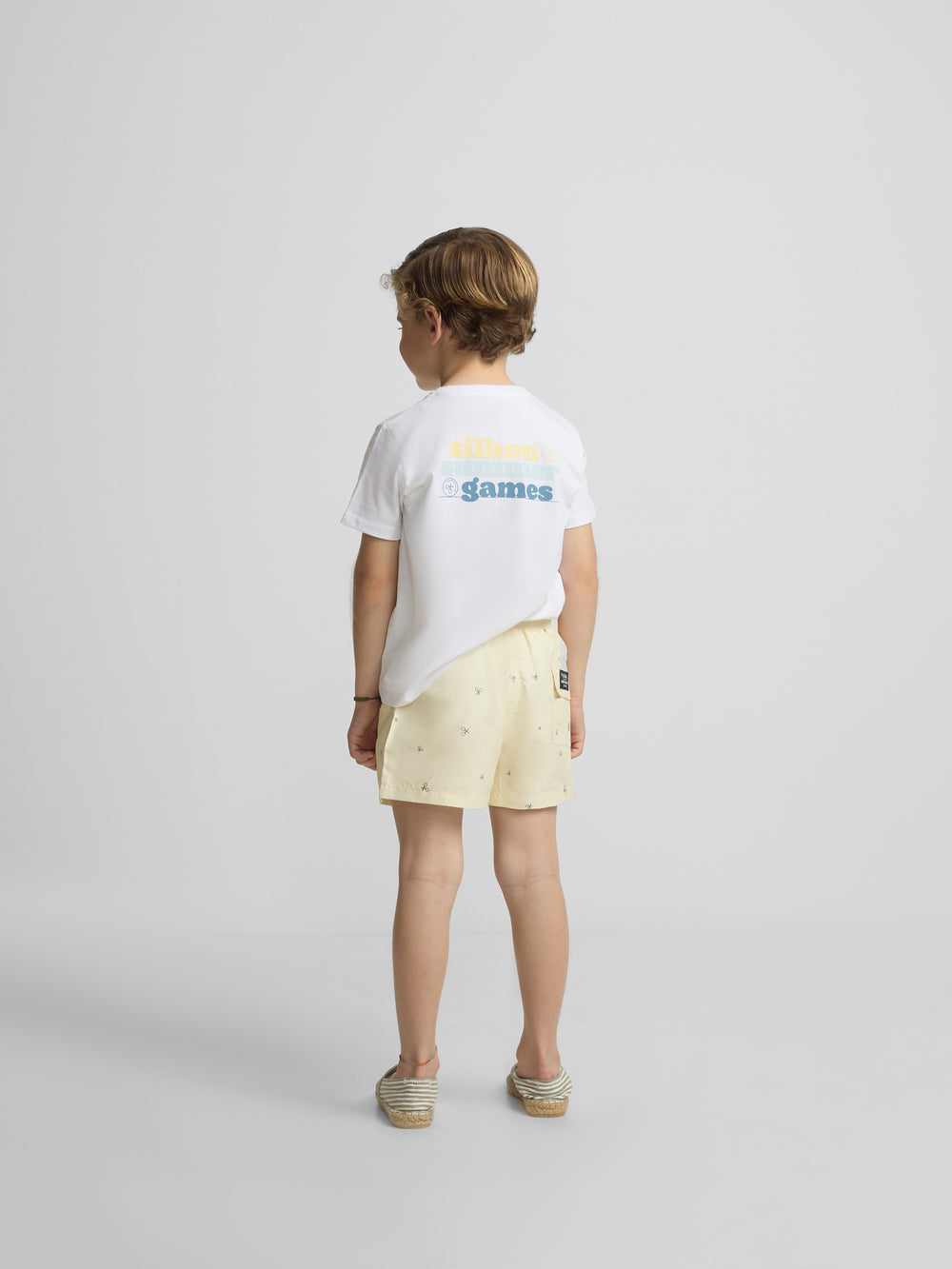 Kids yellow multiracket swimsuit