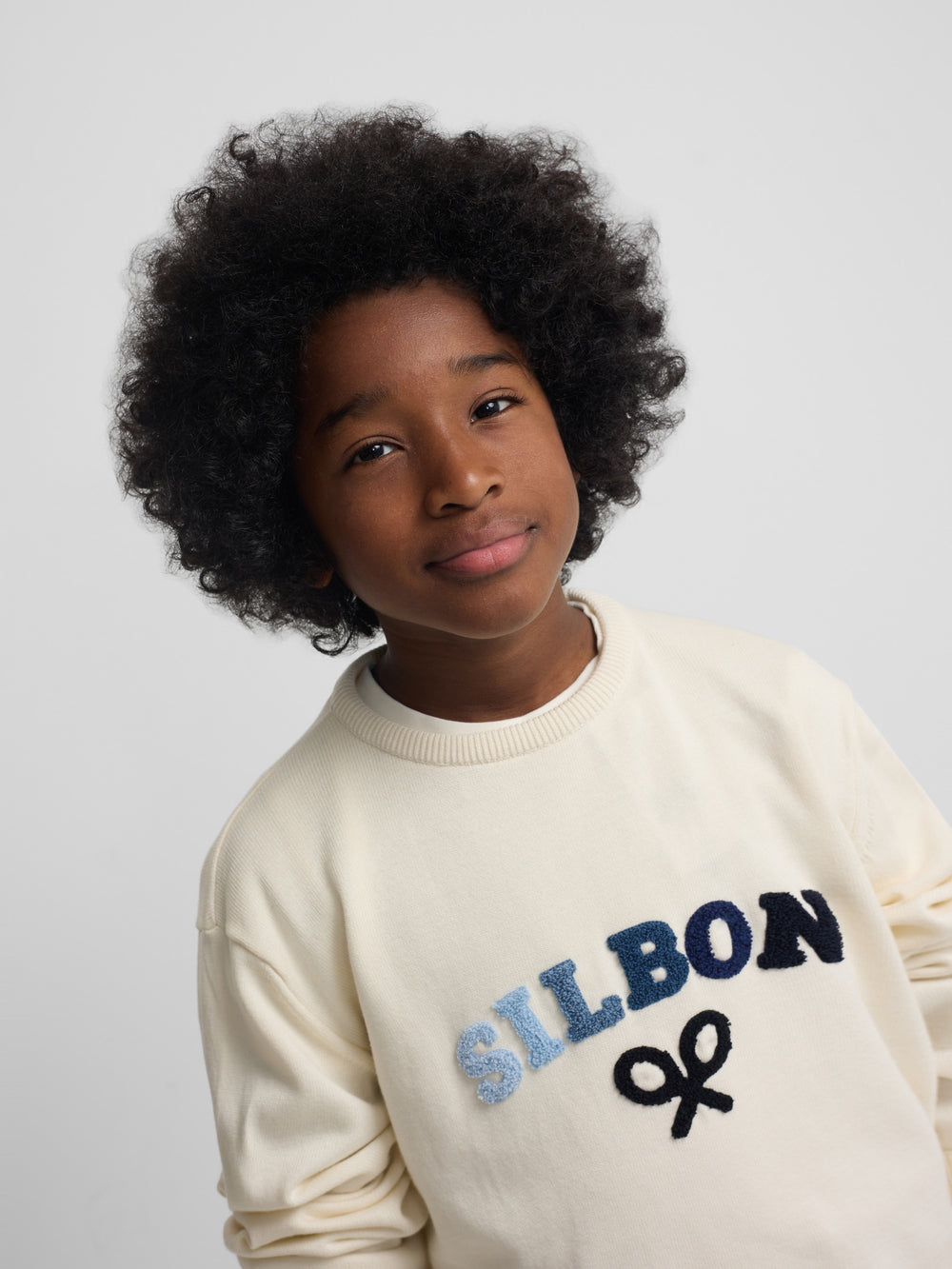 Kids' sweater with colored letters in cream